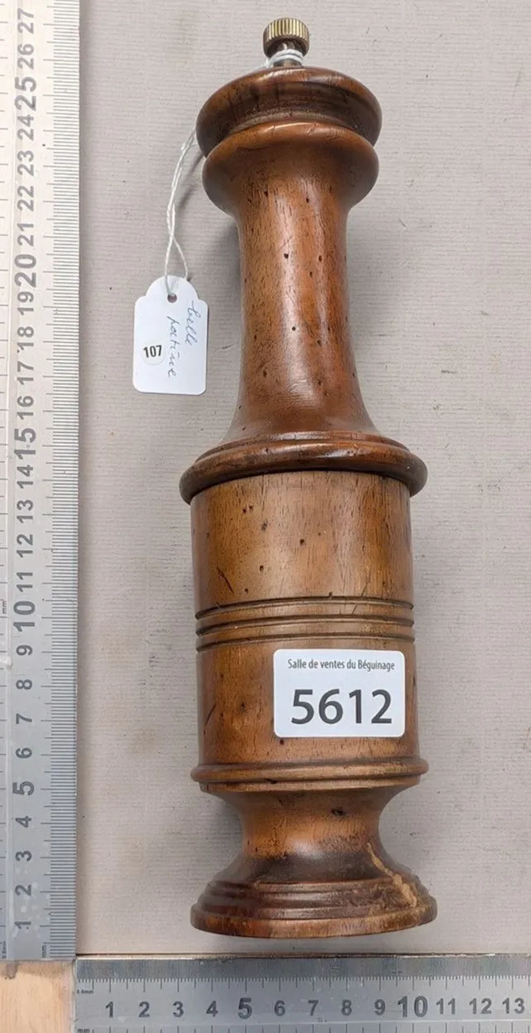 An antique wooden pepper mill from 1900—beautiful patina, made in