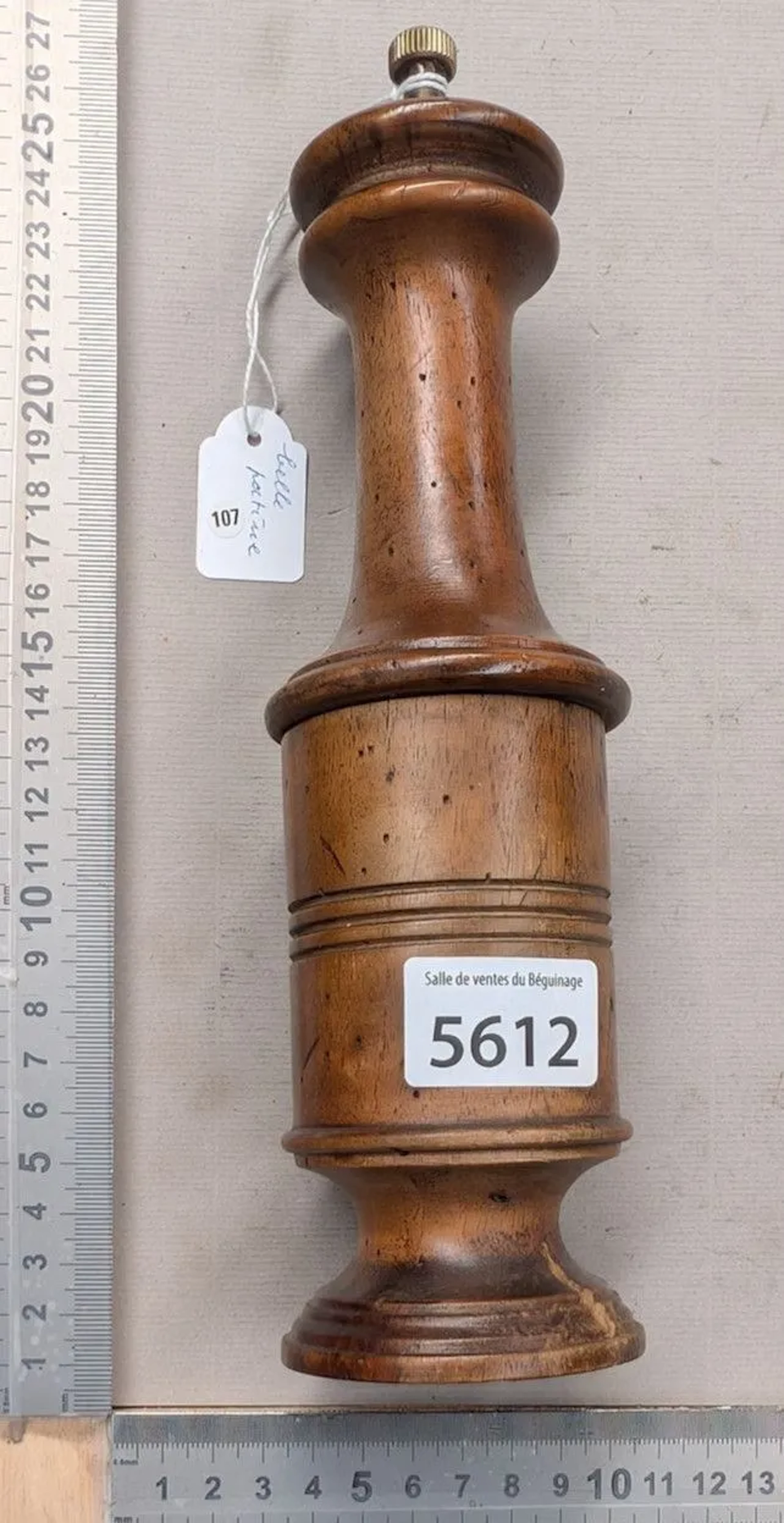 An antique wooden pepper mill from 1900—beautiful patina, made in