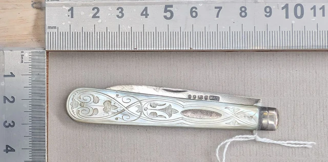1 antique fruit knife with a silver blade and mother-of-pearl handle—see