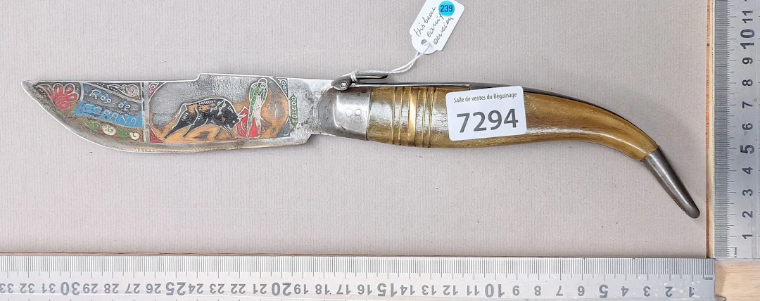Antique knife with a beautifully decorated horn handle—see photos