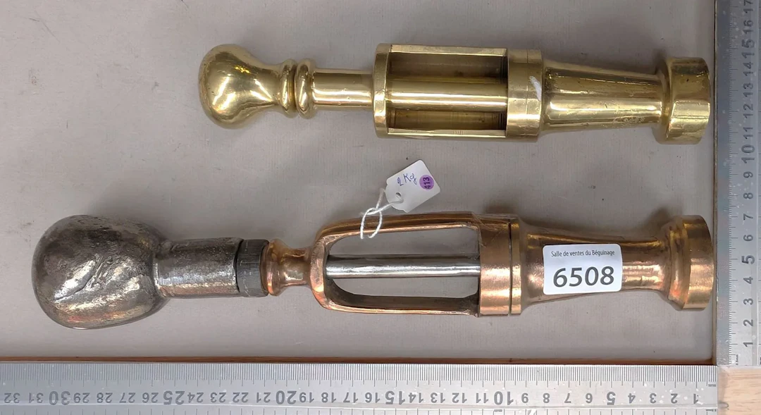 Two antique 2-kg bronze corking machines—see photos for dimensions