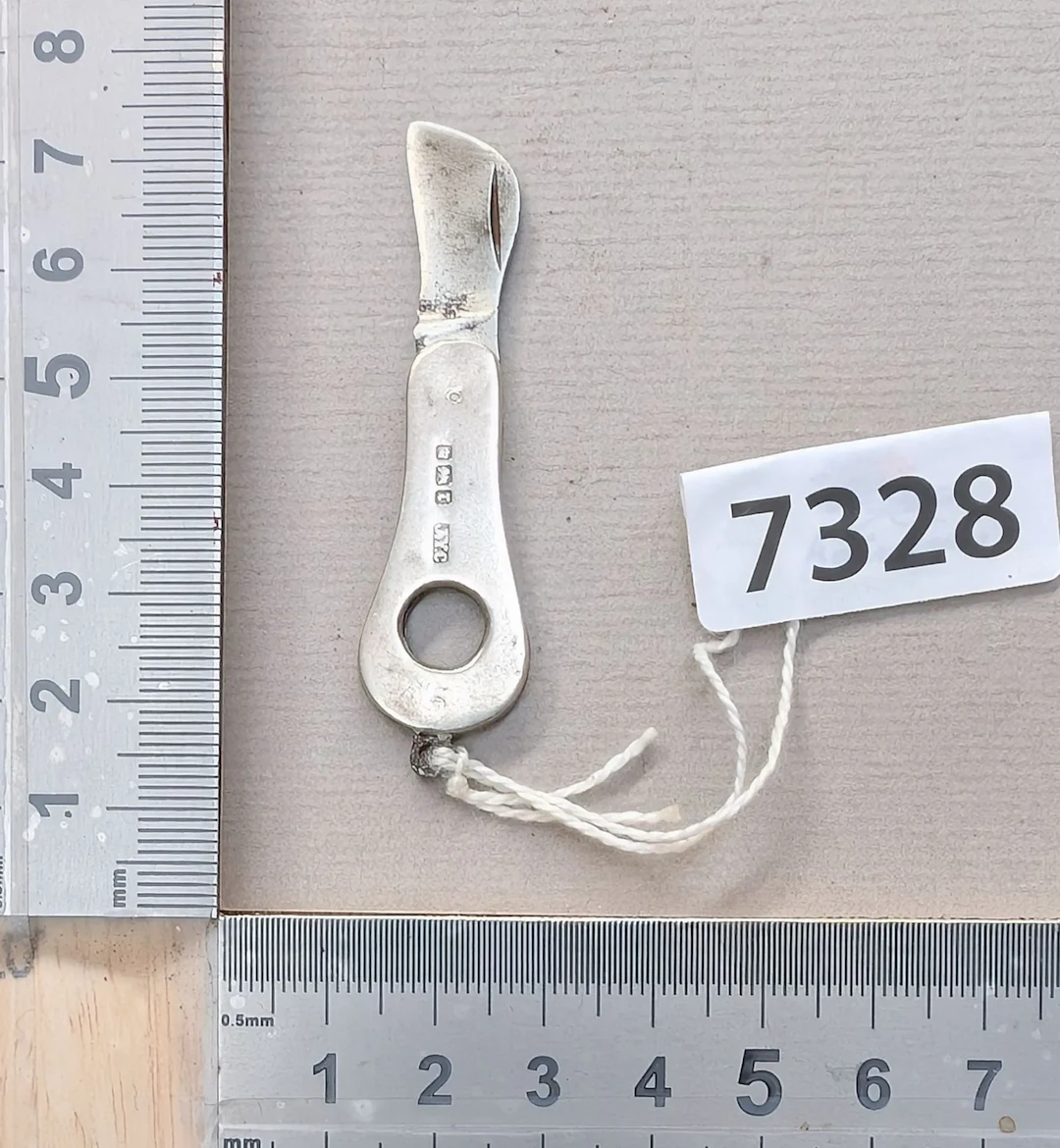 1 mini silver embossed knife—see photos for dimensions and condition