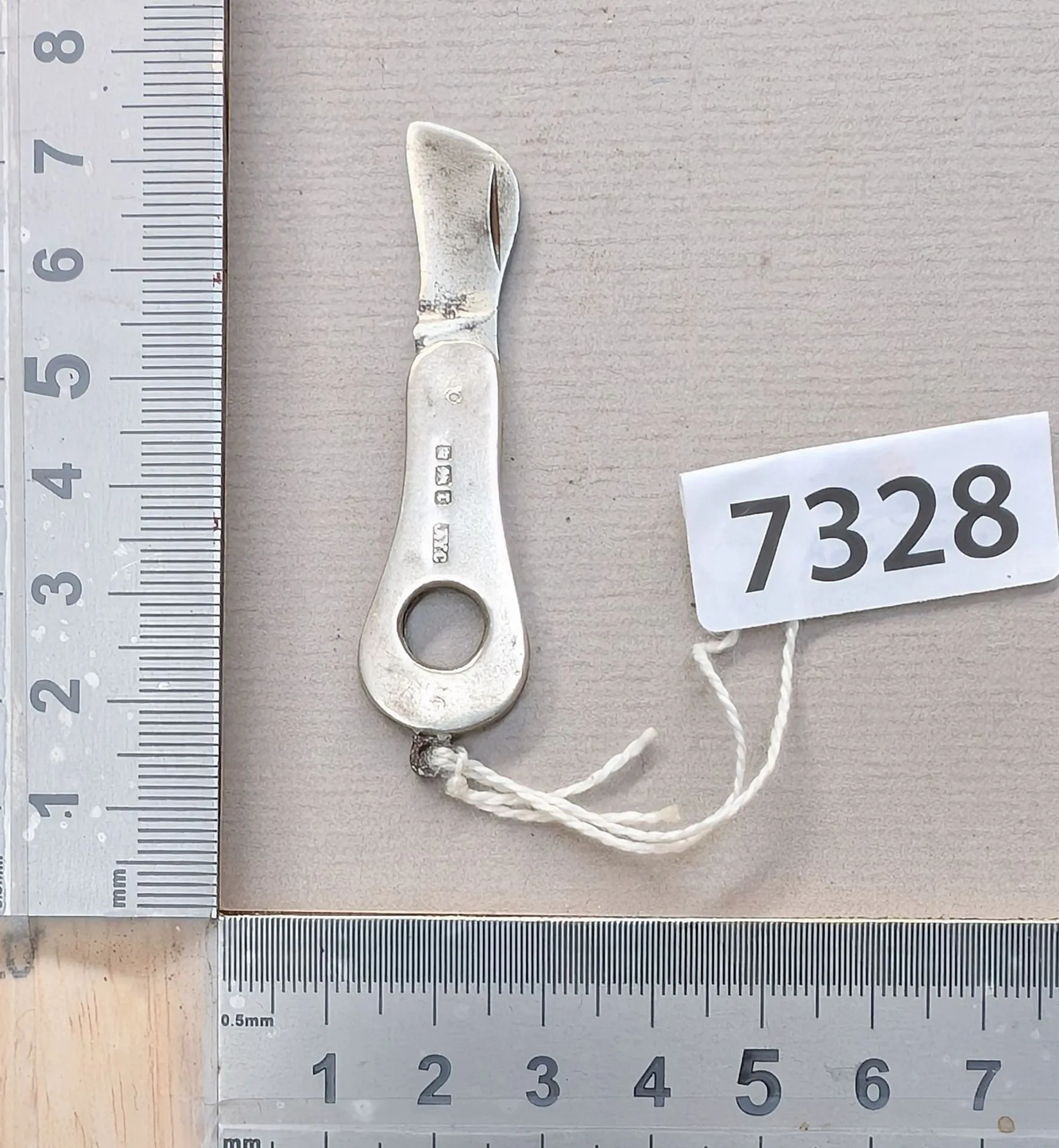1 mini silver embossed knife—see photos for dimensions and condition