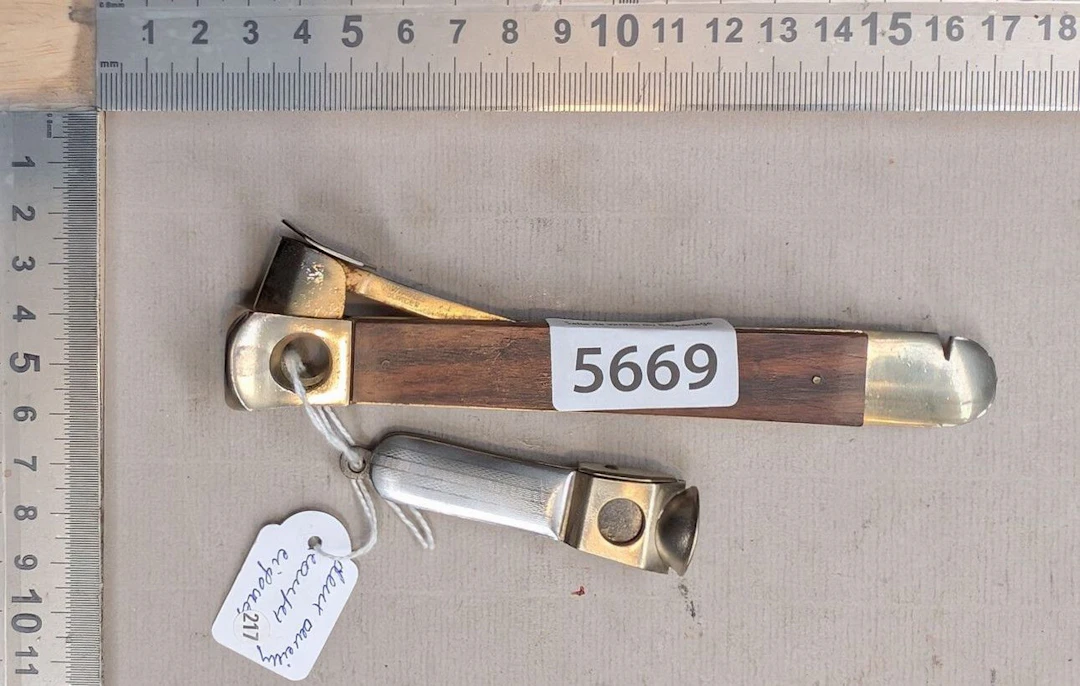 2 antique cigar cutters—see photos for dimensions and condition