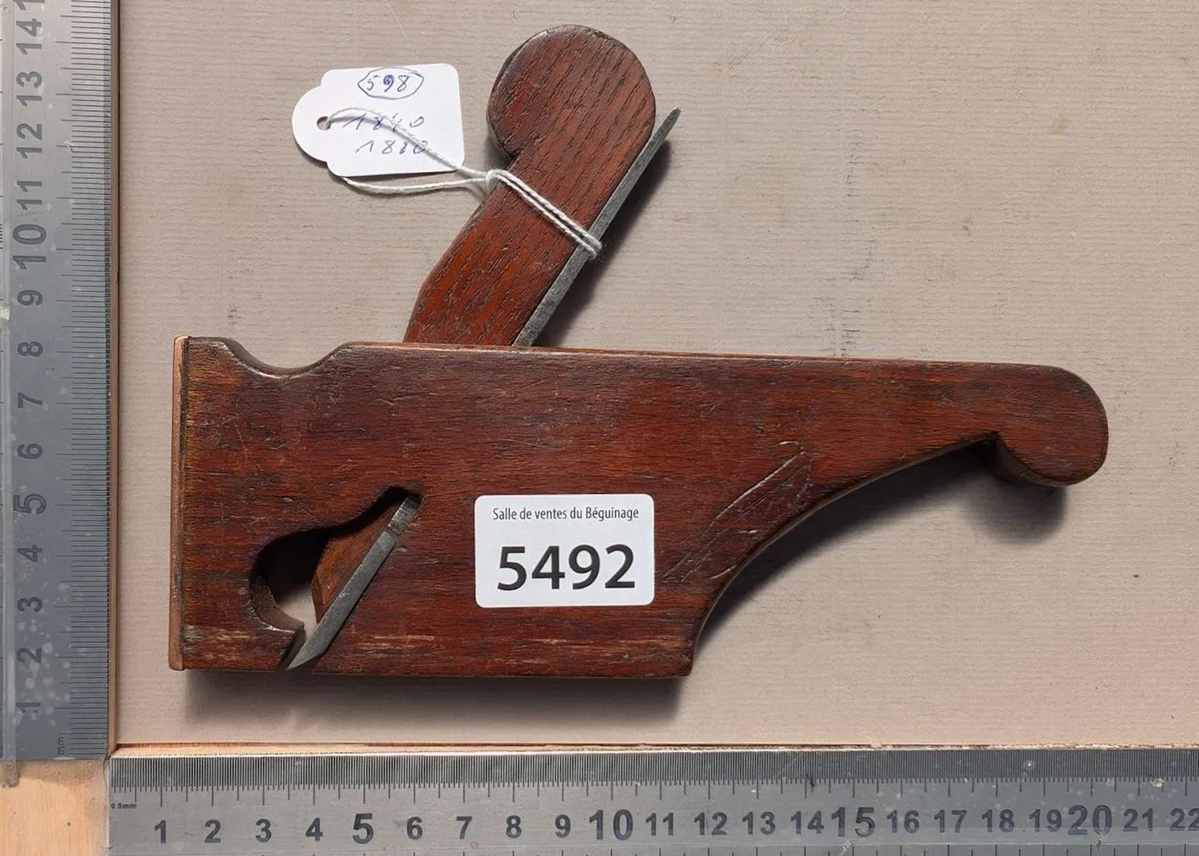 Antique plane with a vertical handle and a brass or copper tip, 1840–1880—see