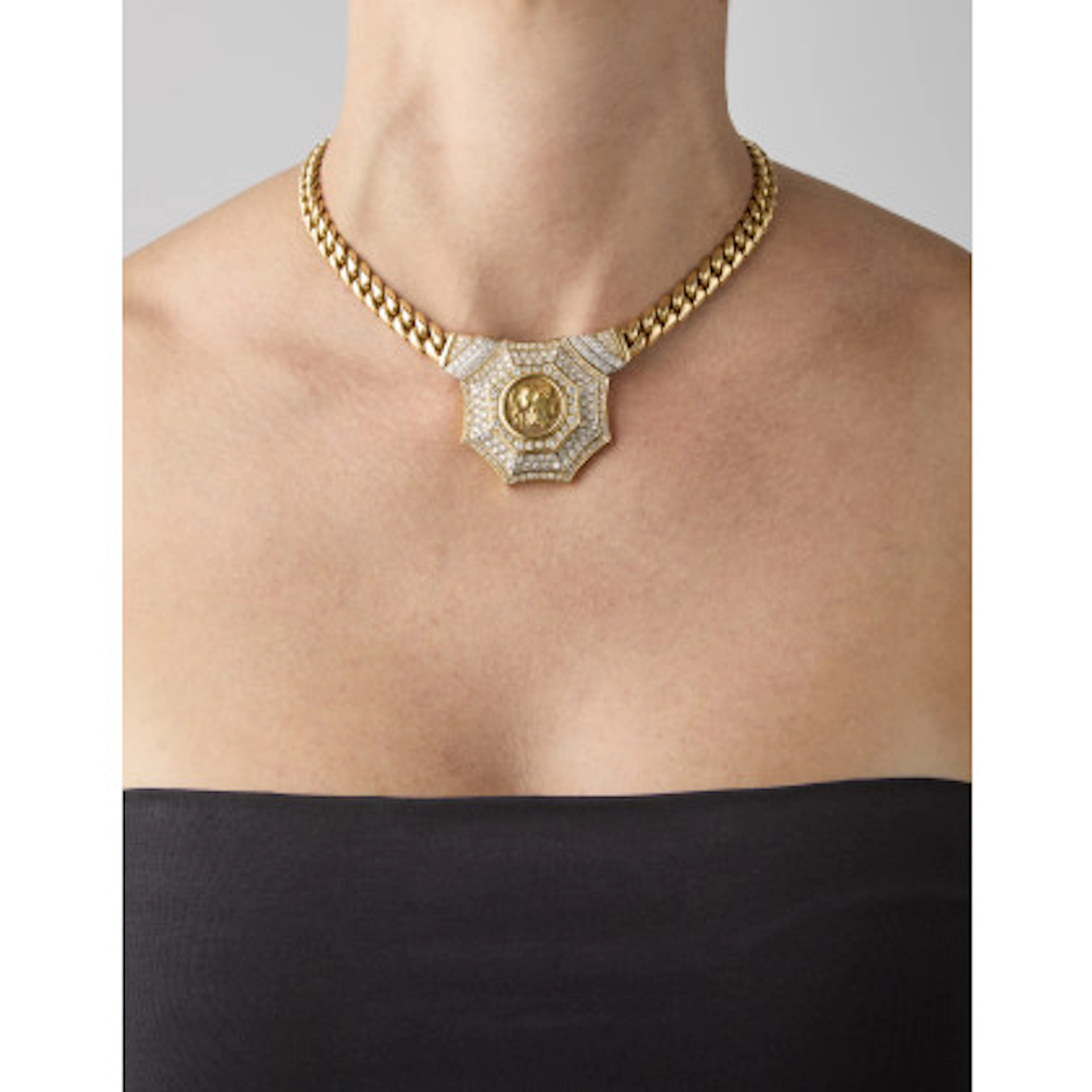 Collana a maglia groumette in oro giallo e bianco con centrale in