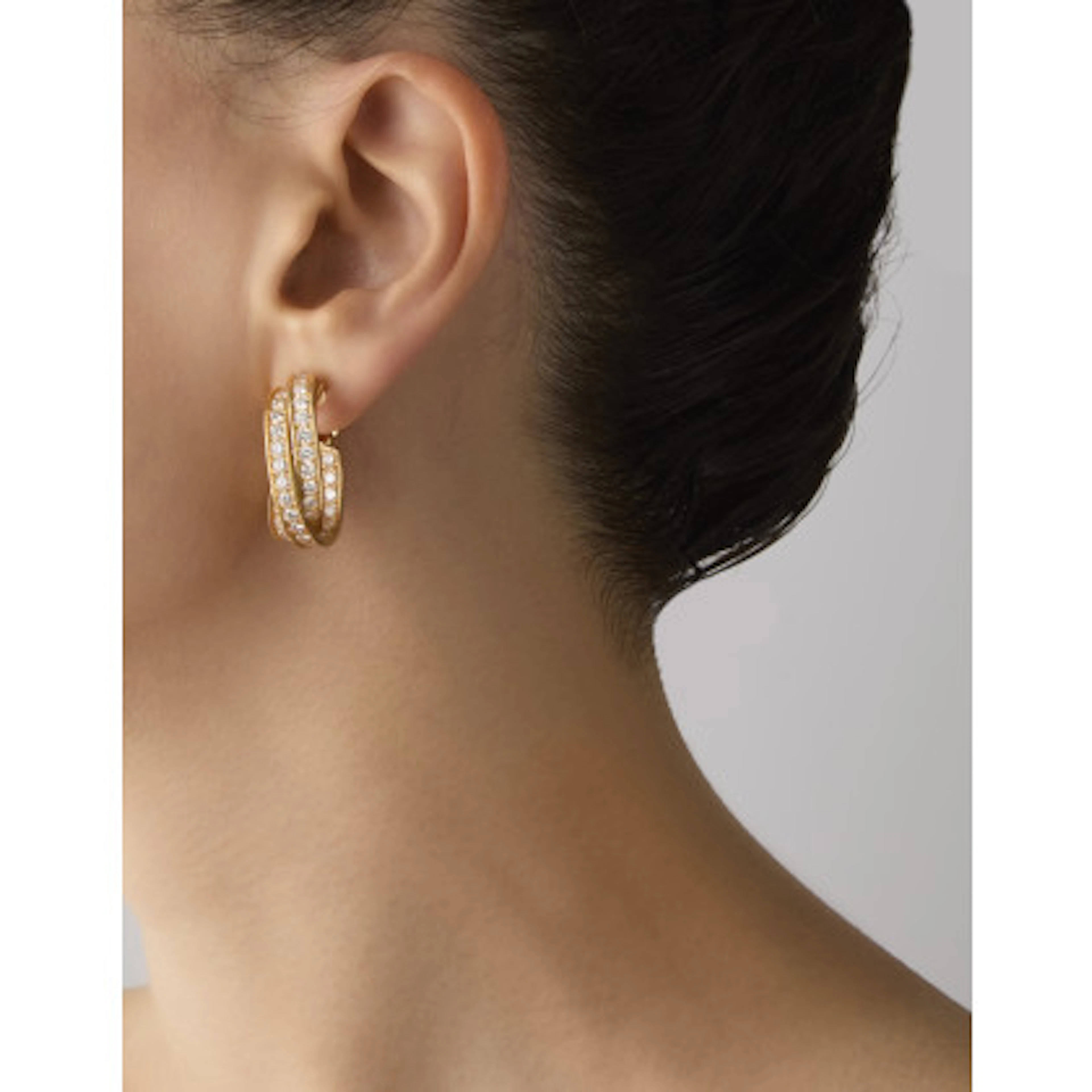 CARTIER Orecchini "Trinity" ad anelle in oro giallo e diamanti tondi