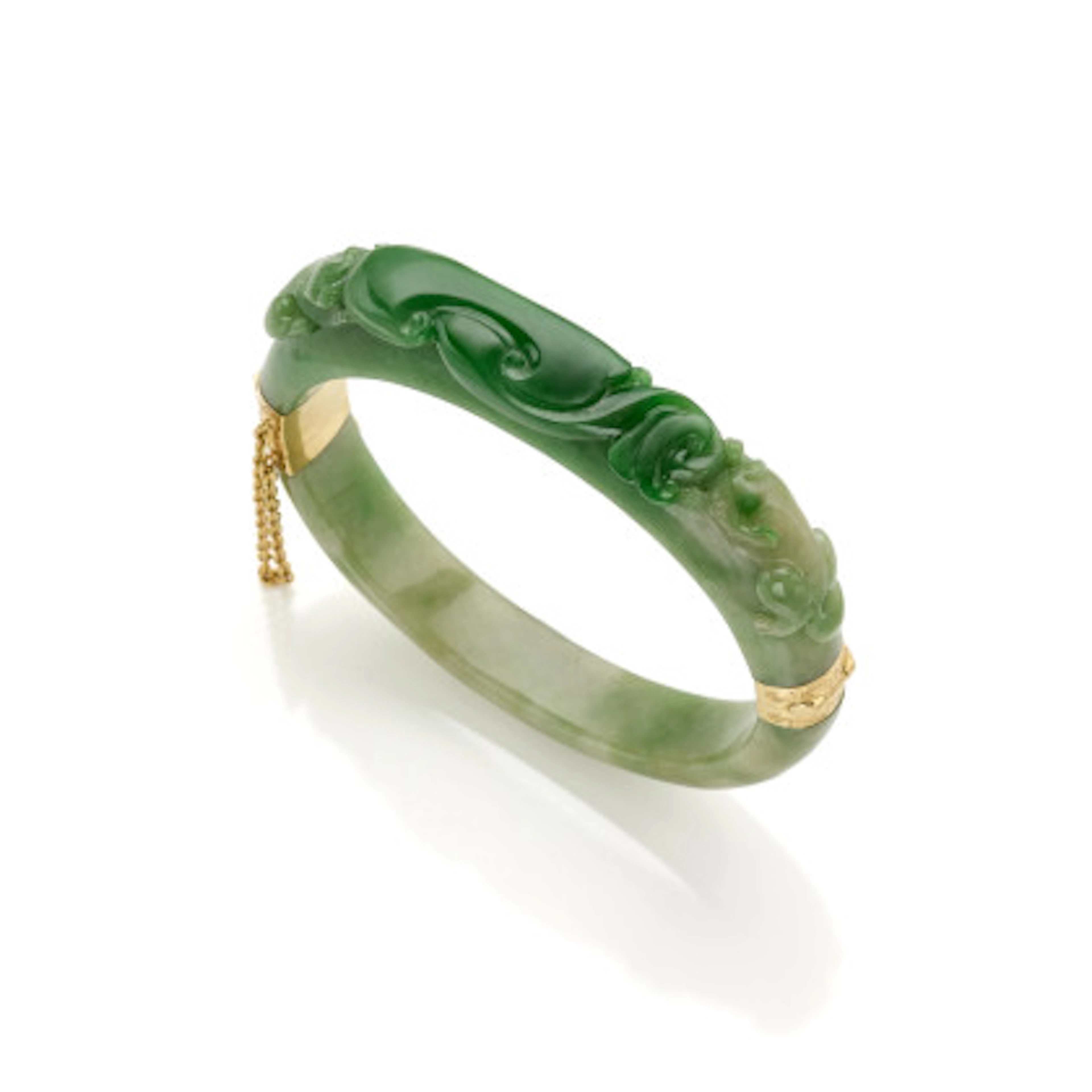 * Bracciale rigido apribile in giadeite scolpita con chiusura in oro