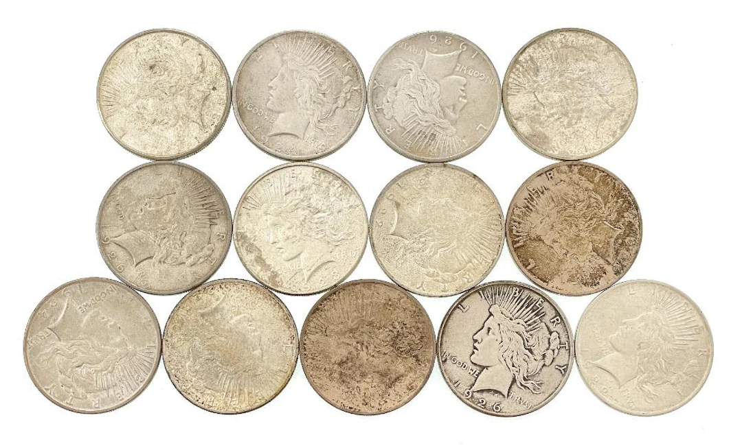 LOT OF 13 ASSORTED 1922-1926 SILVER PEACE DOLLARS