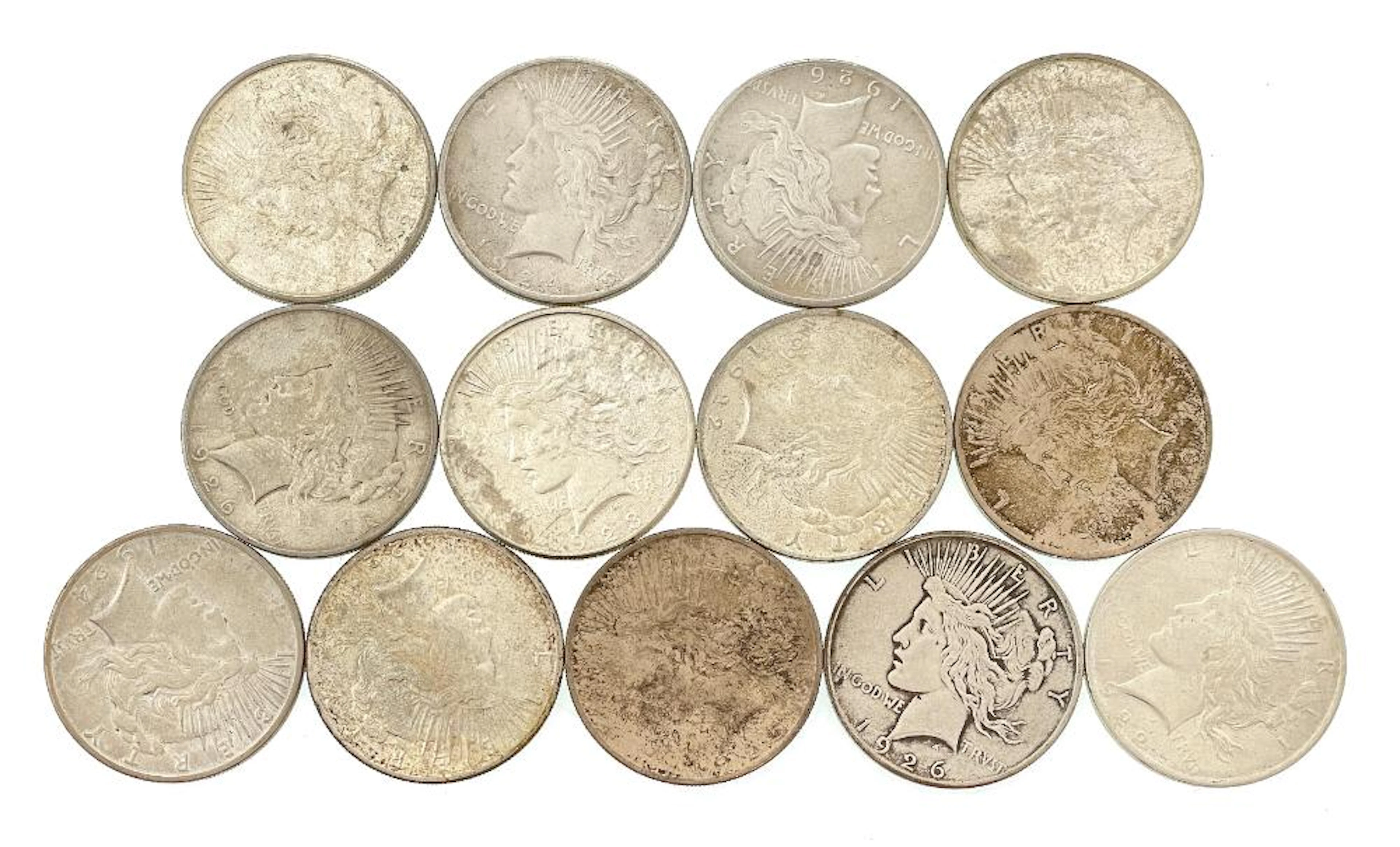 LOT OF 13 ASSORTED 1922-1926 SILVER PEACE DOLLARS