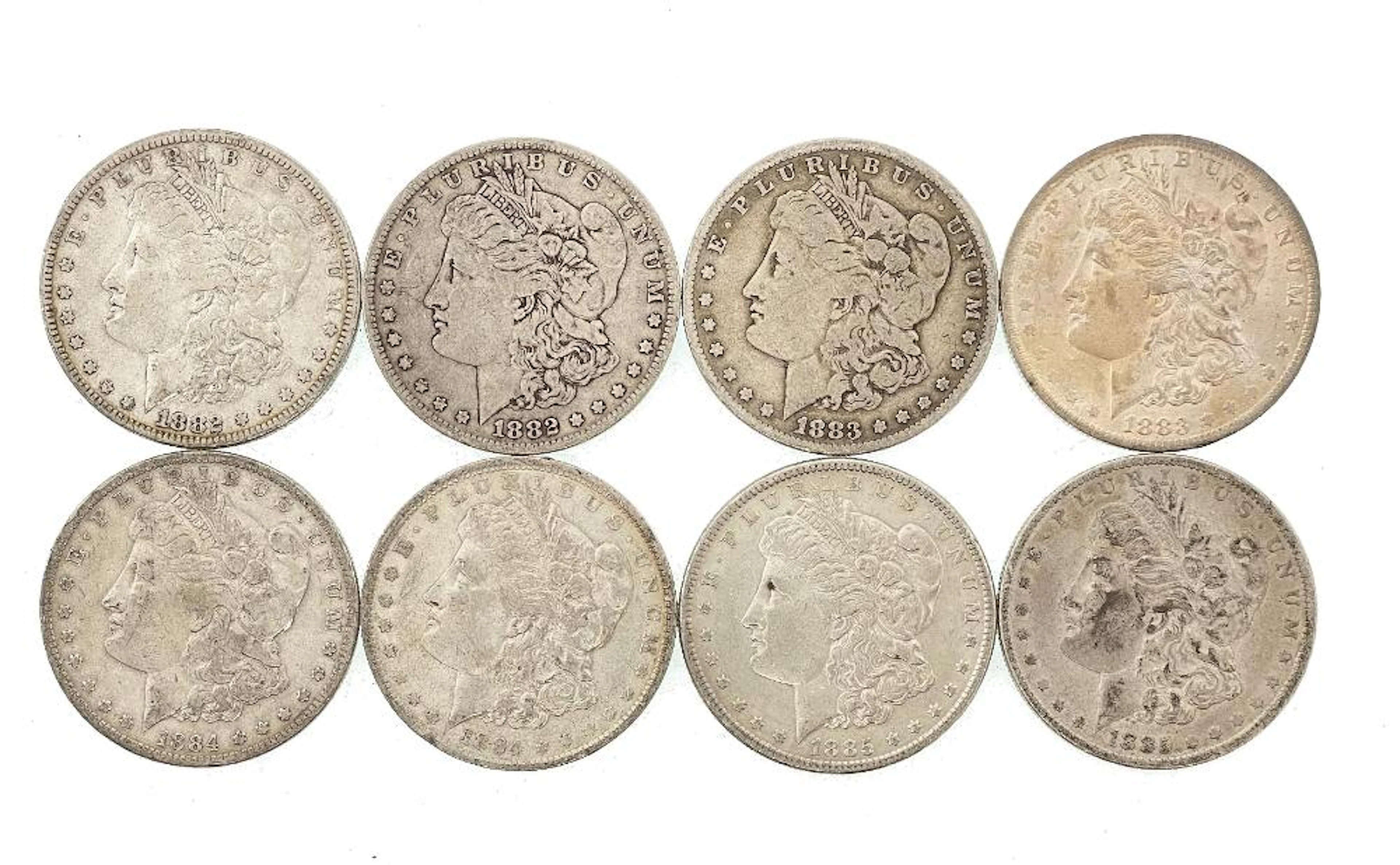 LOT OF 8 ASSORTED 1882-1885 MORGAN SILVER DOLLARS