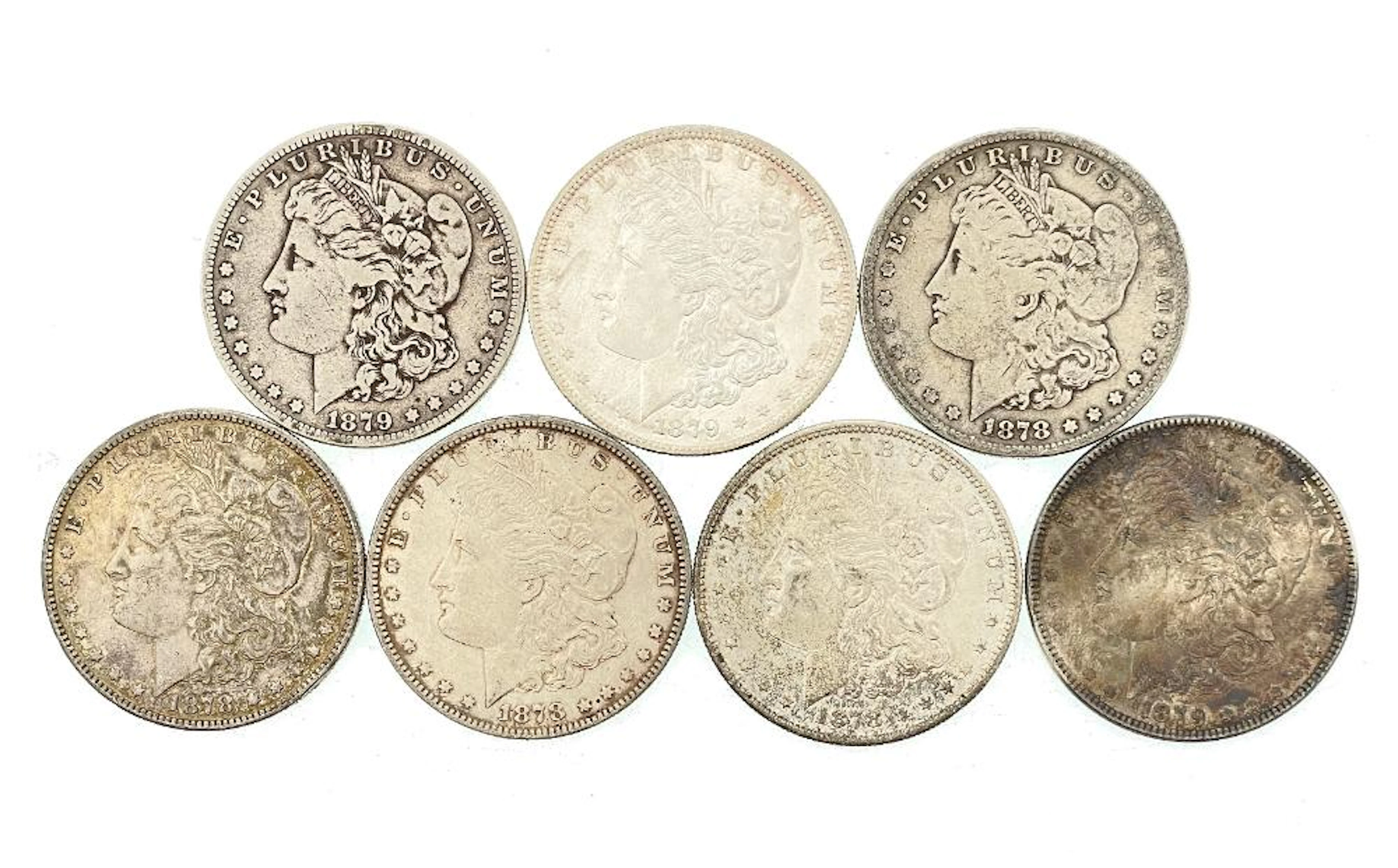 LOT OF 7 ASSORTED 1878 & 1879 MORGAN SILVER DOLLARS
