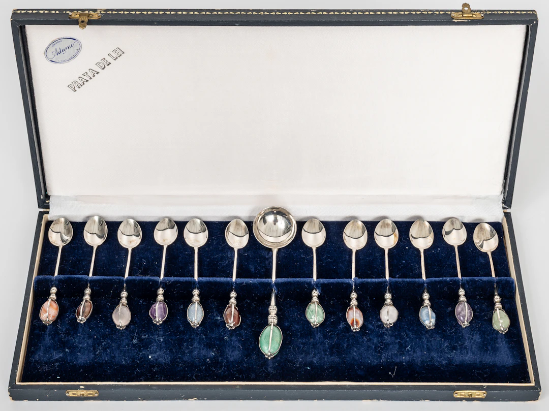Lot 300: SILVER SPOORN SET COMPRISING 12 MOCHA SPOONS AND 1 LARGER