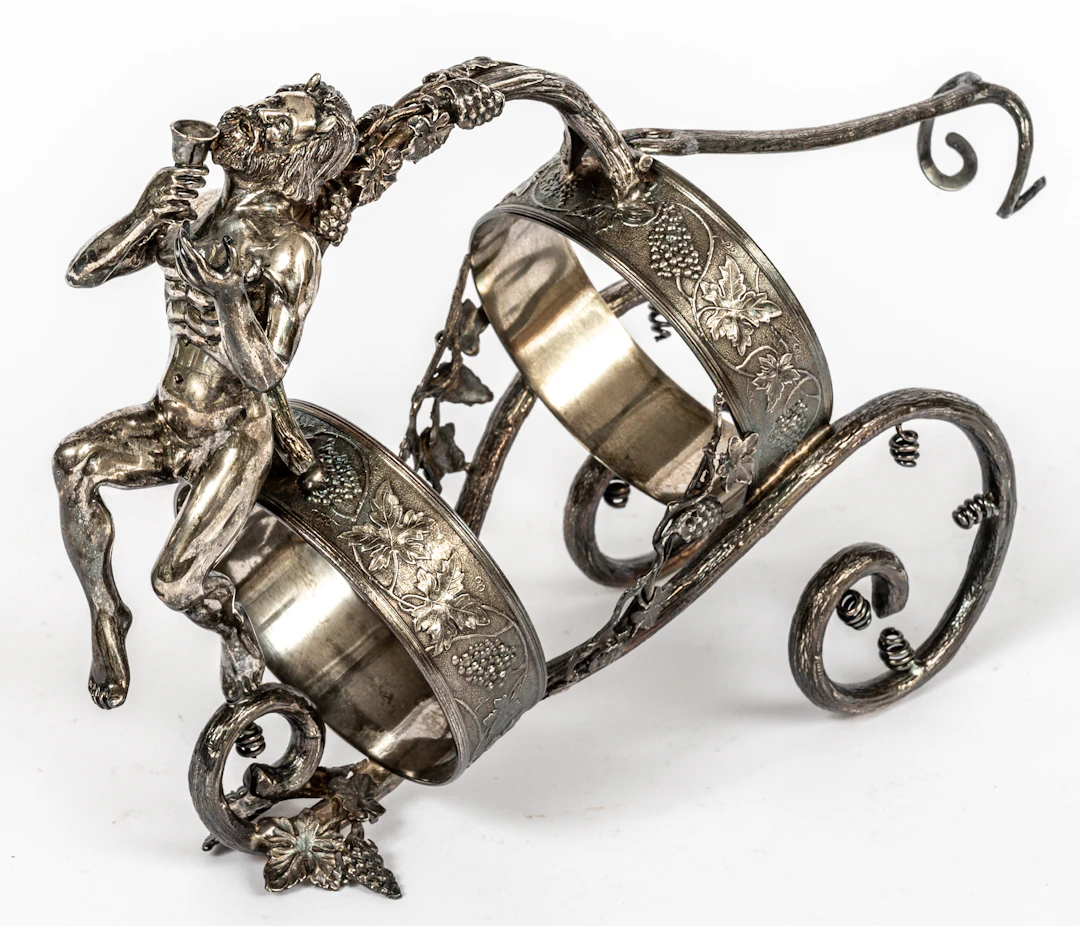 Lot 278: PERUVIAN CAMUSSO BOTTLE HOLDER WITH A SEATED SATYR FIGURE