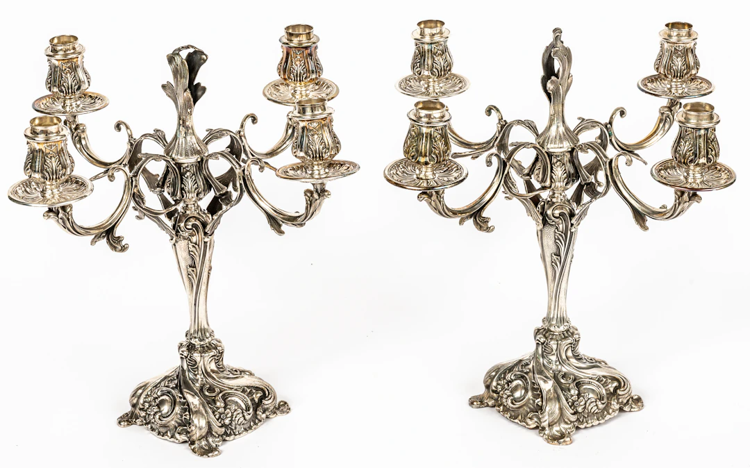 Lot 284: A PAIR OF PERUVIAN CAMUSSO FOUR-ARM CEREMONIAL CANDELABRA