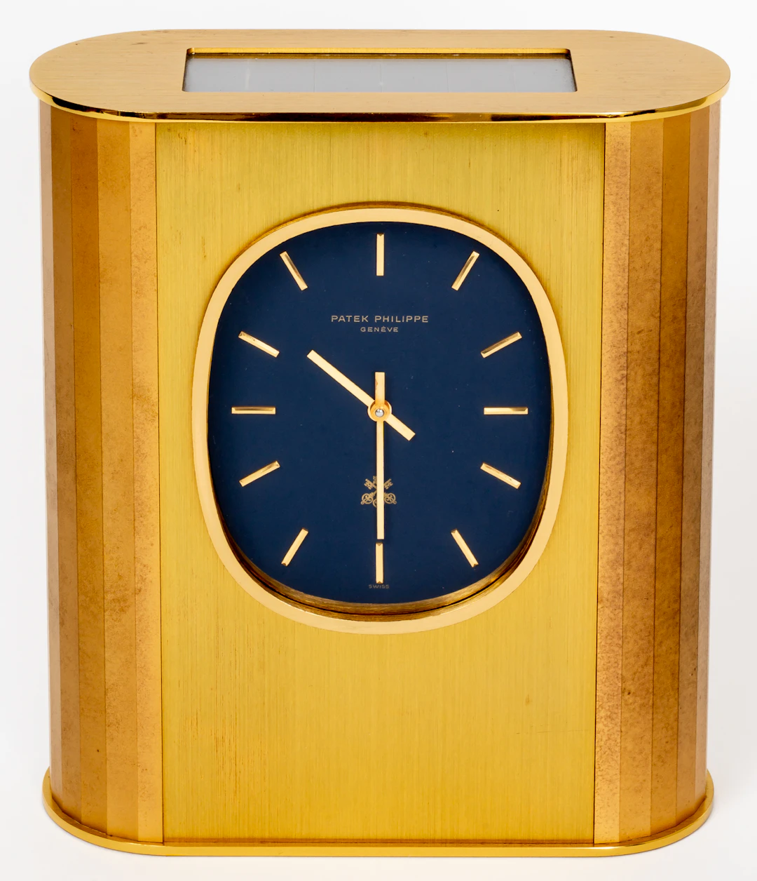 Lot 325: PATEK PHILIPPE "GOLDEN ELLIPSE" SOLAR TABLE CLOCK