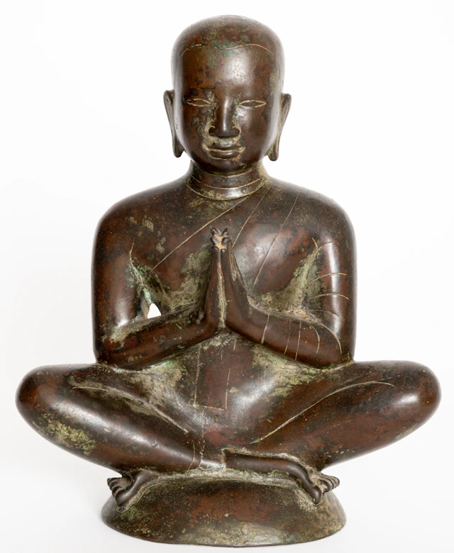 Lot 44: BRONZE FIGURE SHOWING A SEATED MONK