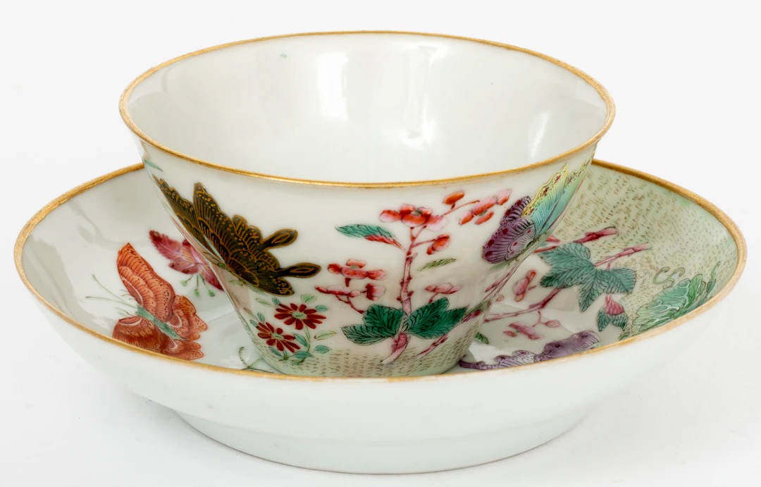 Lot 23: CHINESE PORCELAIN CUP AND SAUCER WITH FAMILLE-ROSE DECOR