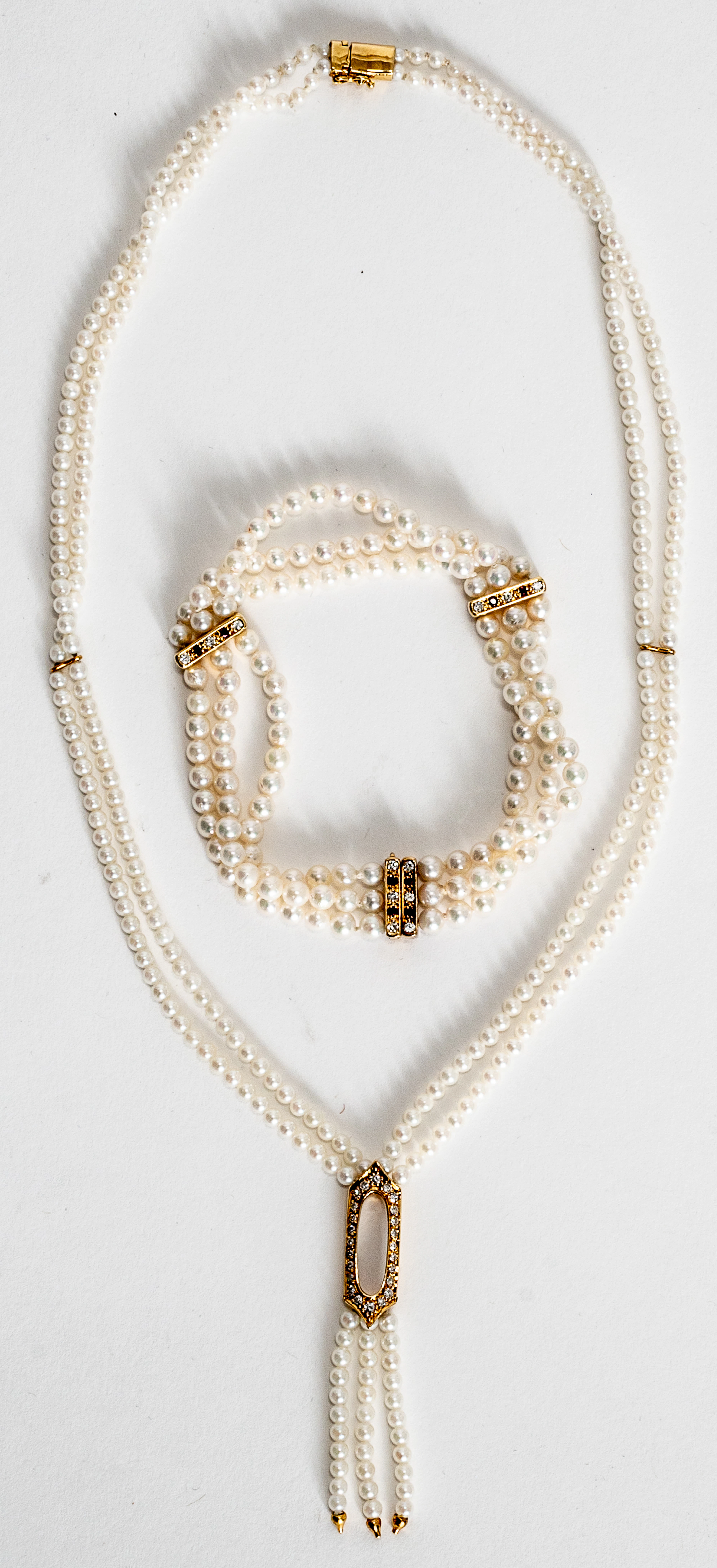 Lot 269: DOUBLE-STRAND PEARL NECKLACE AND THREE-STRAND BRACELET
