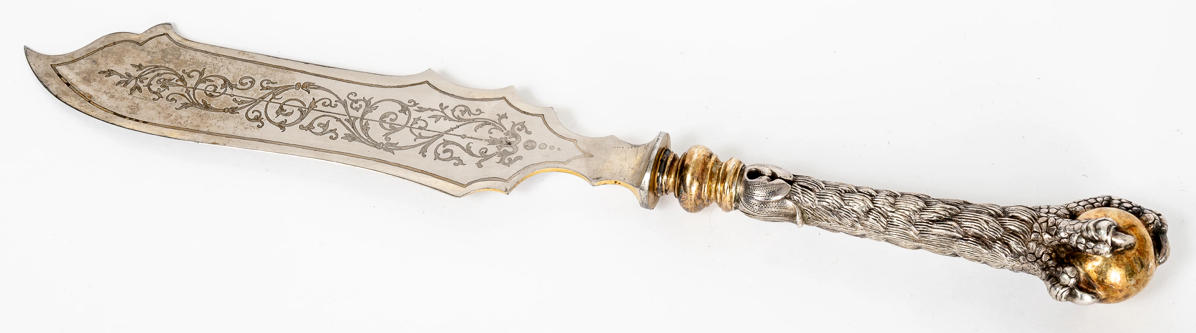 Lot 301: SILVER CARVING KNIFE SHOWING A GRIPPING CLAW WITH A GOLD-PLATED BALL