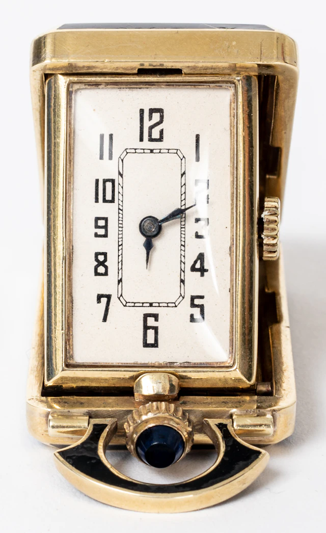 Lot 313: LADIES' GOLD AND GREEN ENAMEL TRAVEL CLOCK
