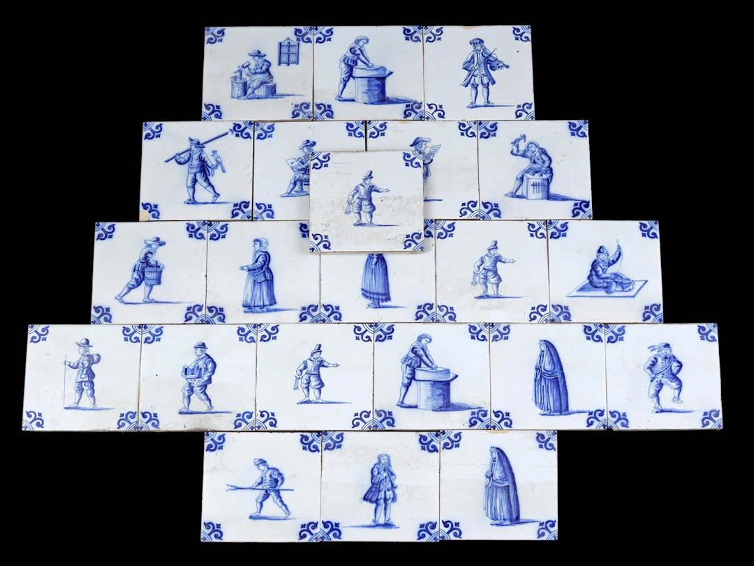 22 aardewerken tegels naar antiek model met blauw decor...