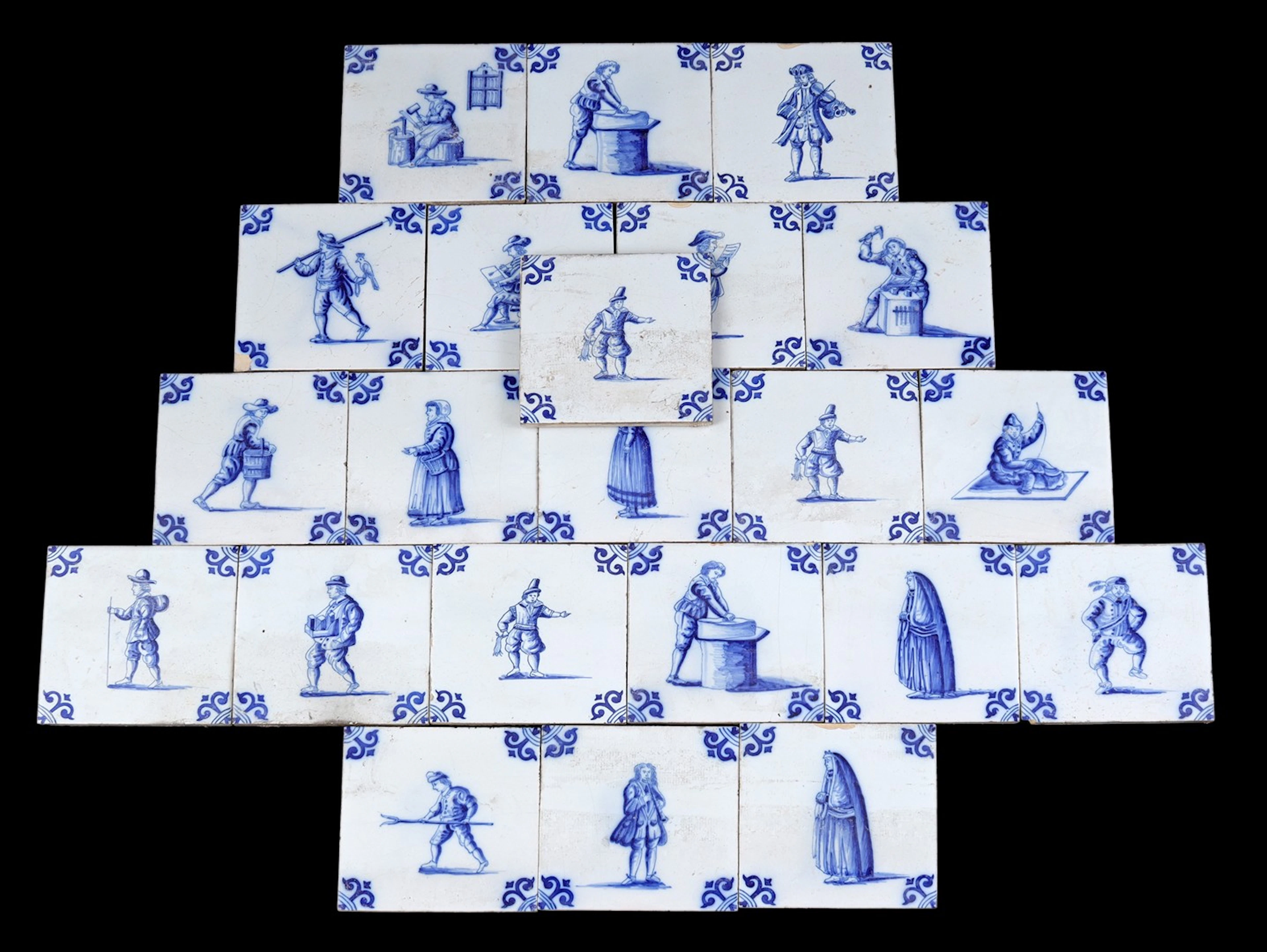 22 aardewerken tegels naar antiek model met blauw decor...