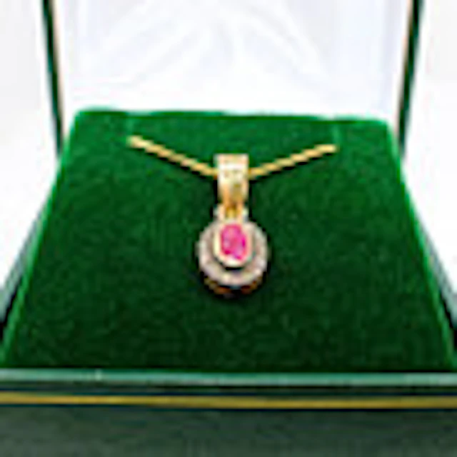 RUBY & DIAMOND PENDANT NECKLACE.