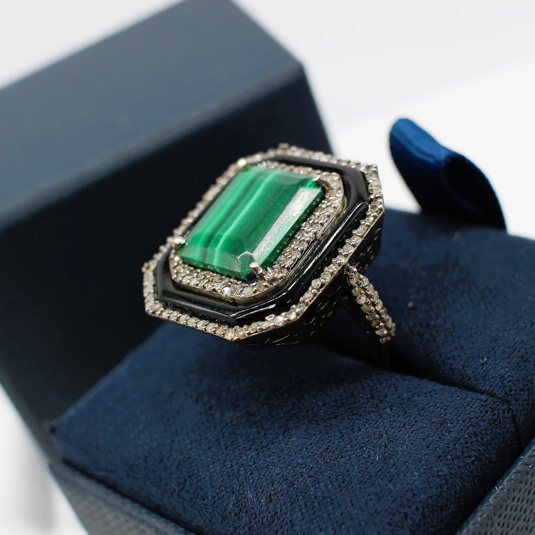 MALACHITE, ONYX & DIAMOND RING.