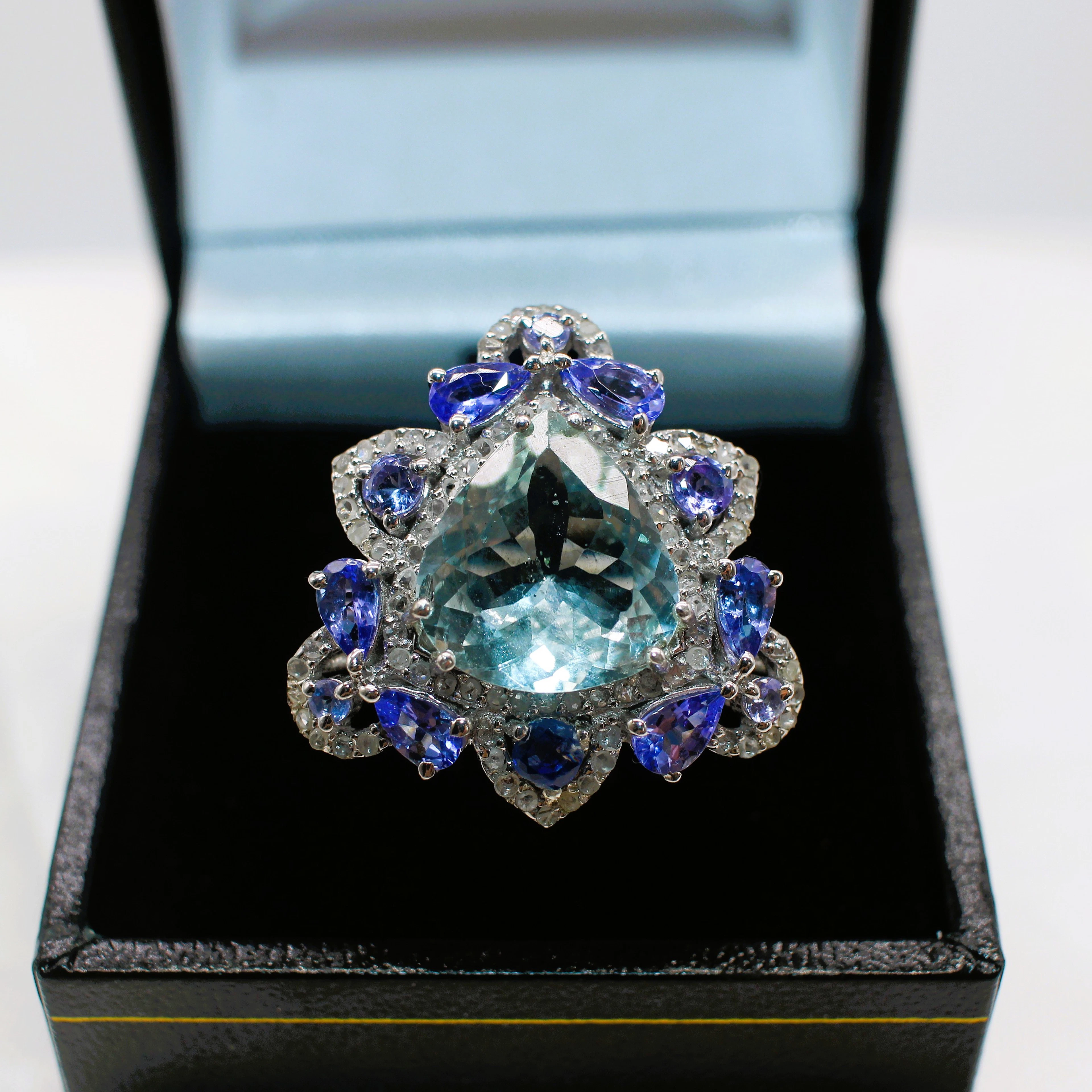 AQUAMARINE, TANZANITE, KYANITE & DIAMOND RING.
