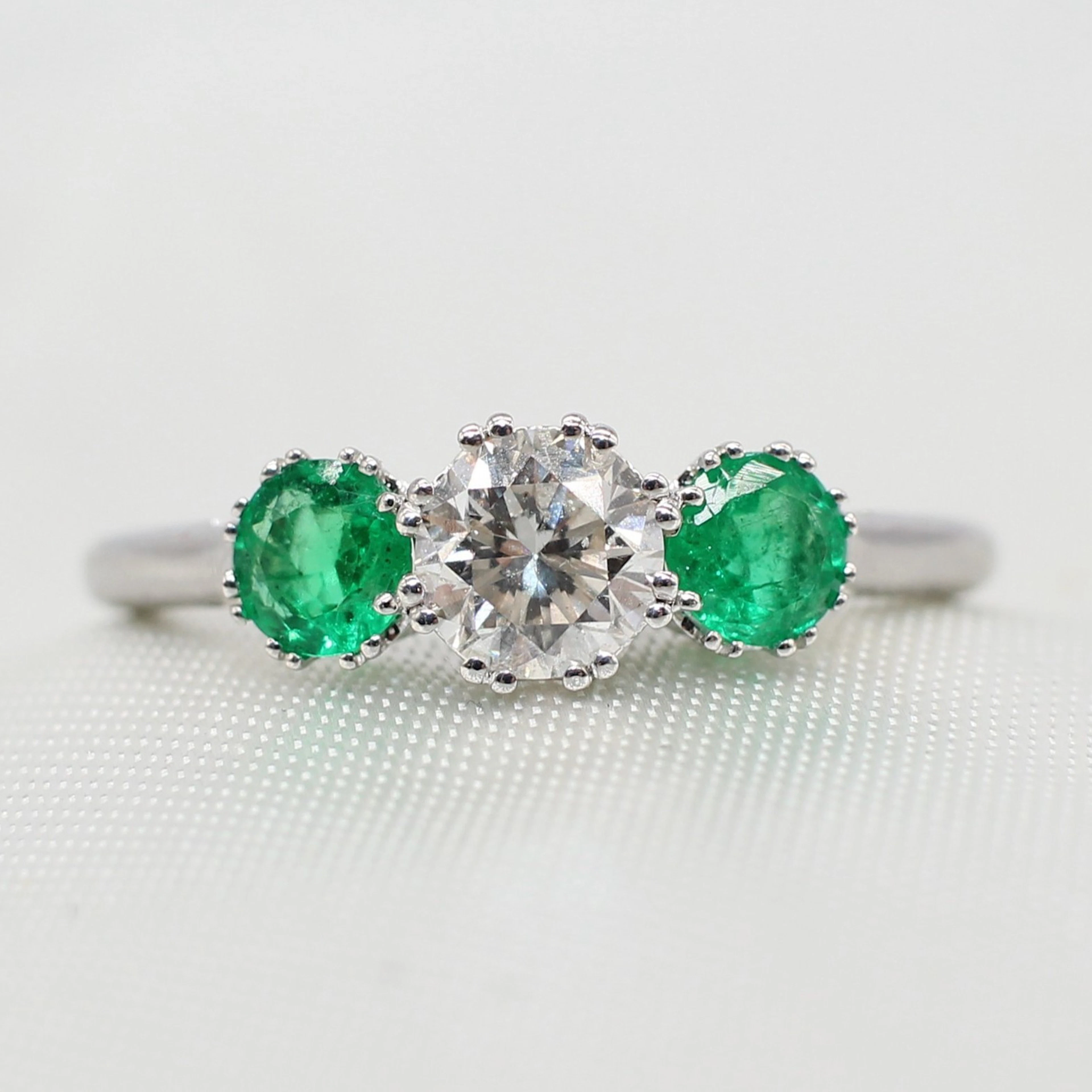 EMERALD & DIAMOND TRILOGY RING.