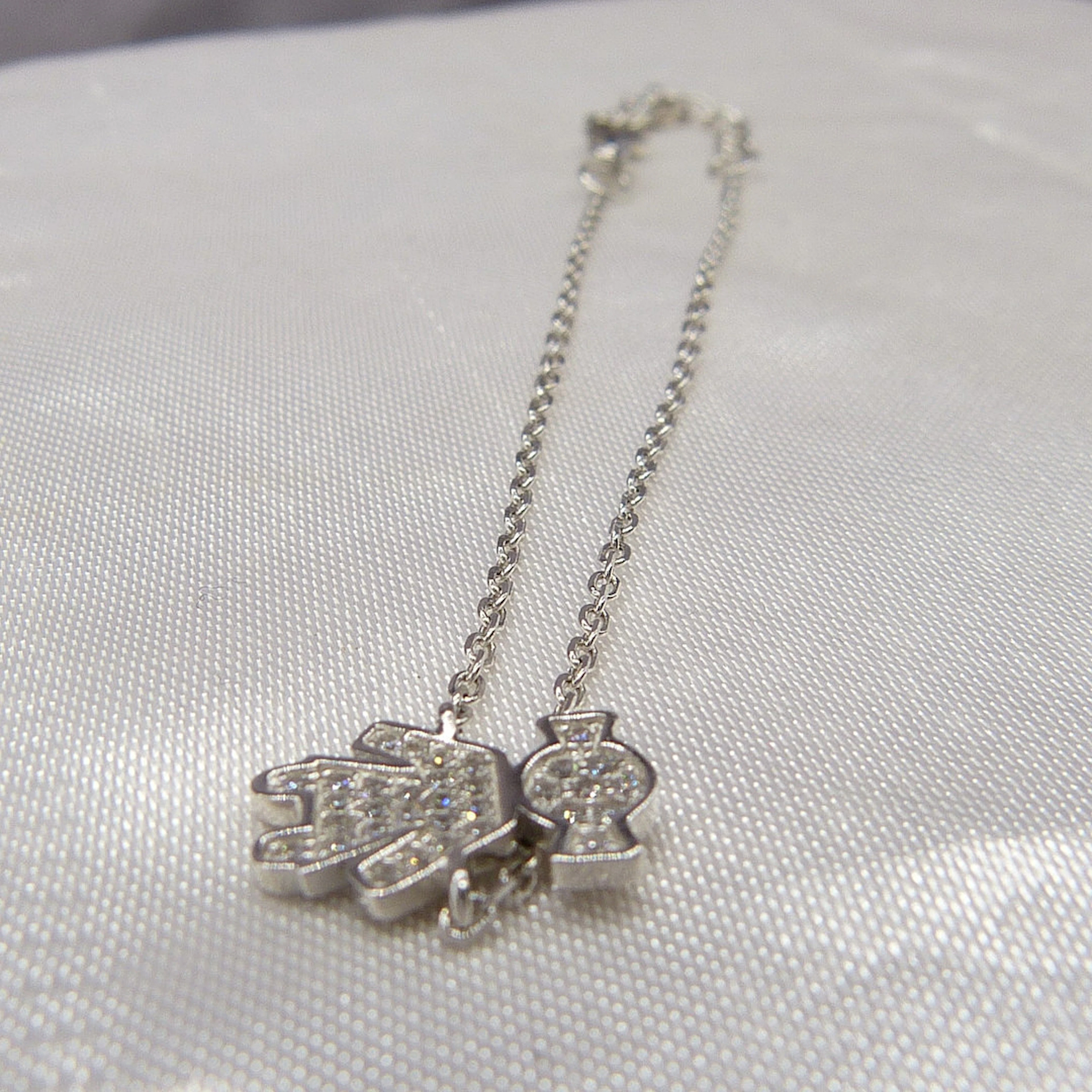 A SILVER "DOLLY" BRACELET.