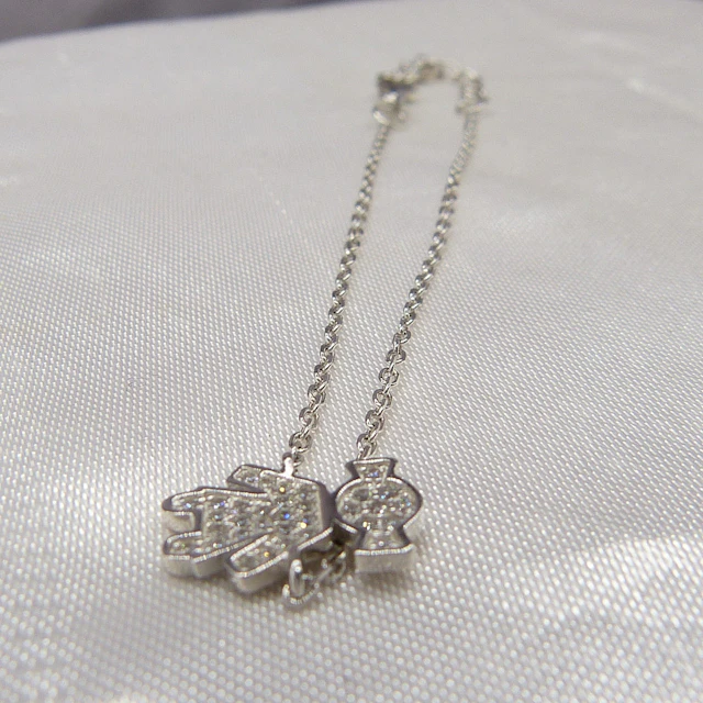 A SILVER "DOLLY" BRACELET.