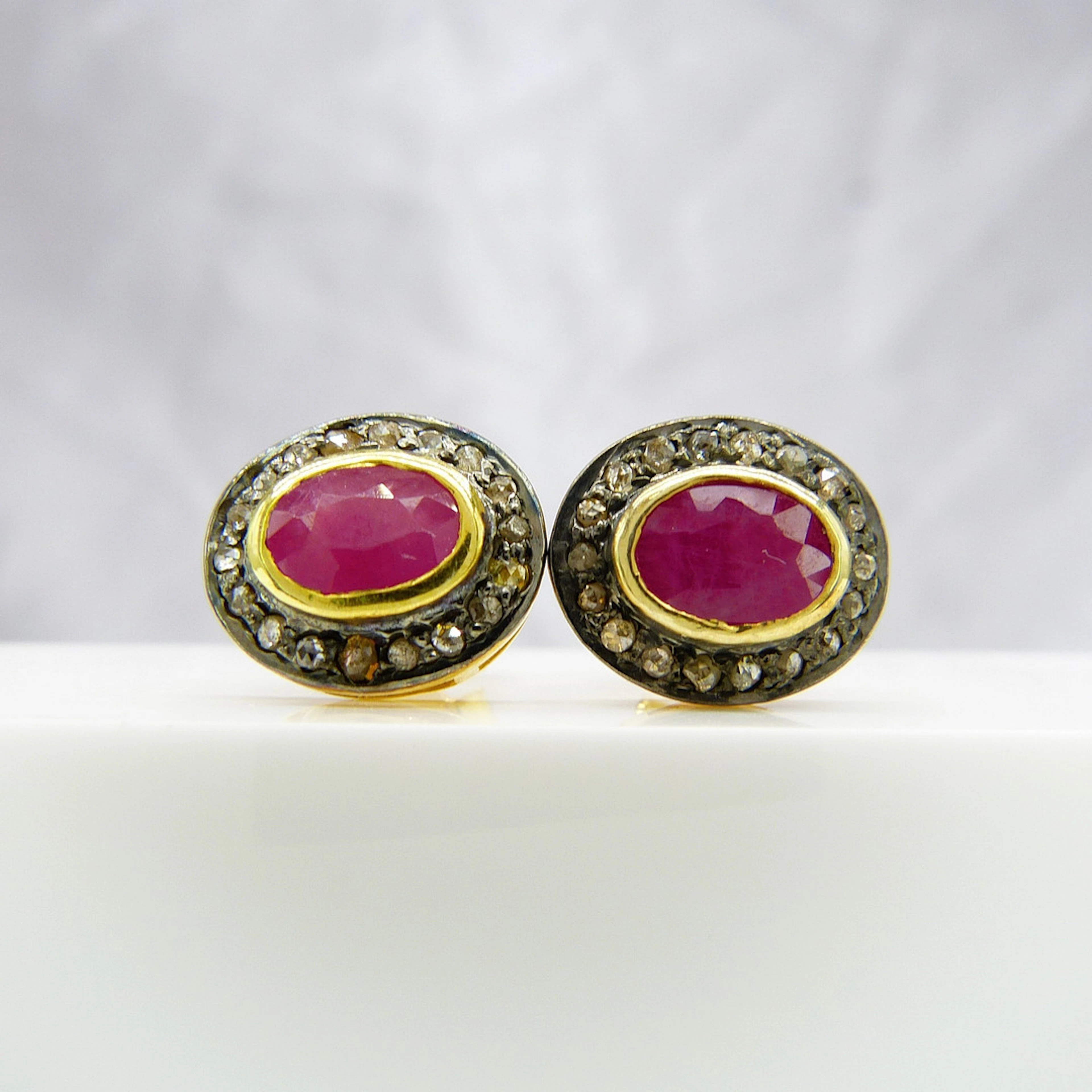 RUBY & DIAMOND EAR STUDS.