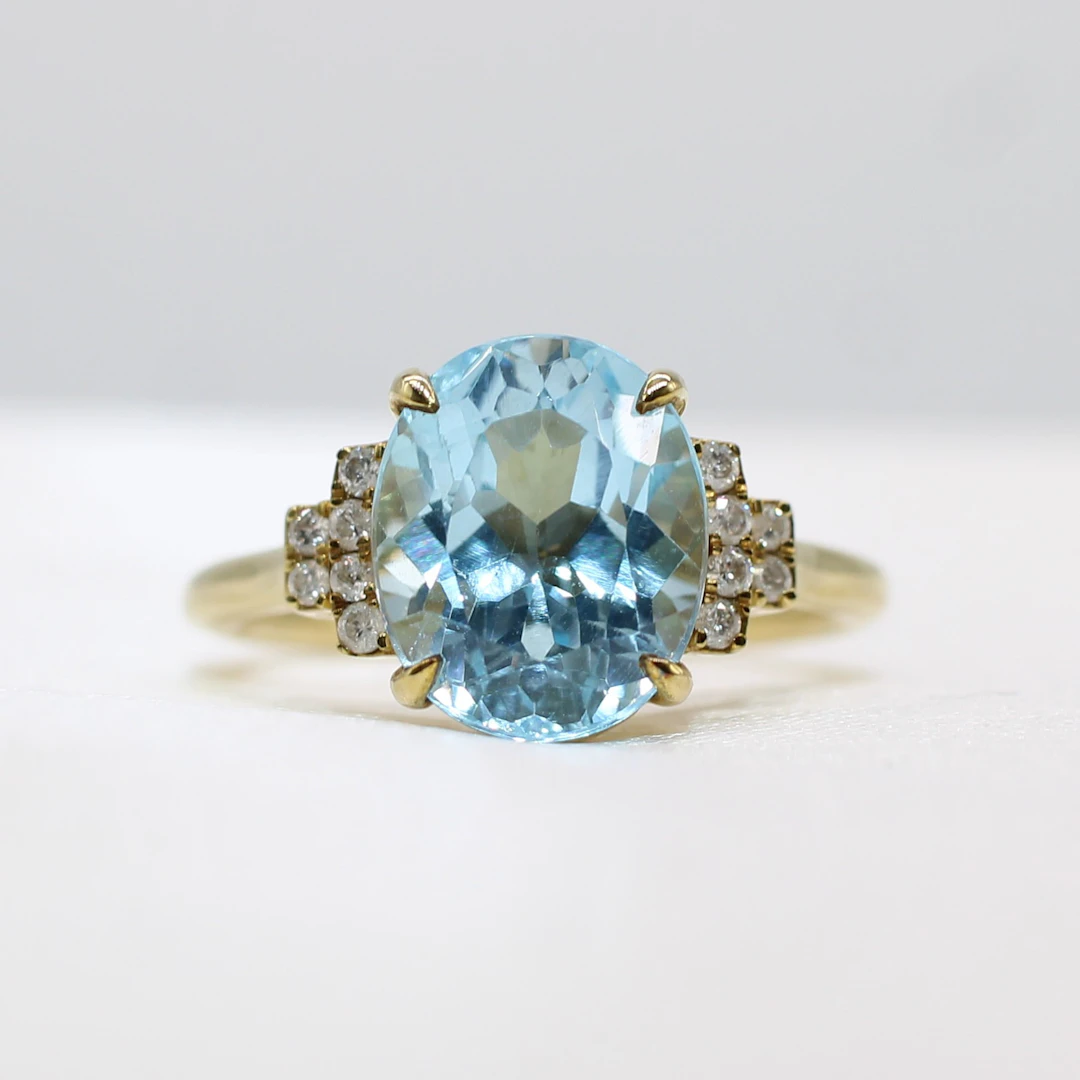 BLUE TOPAZ & DIAMOND RING.