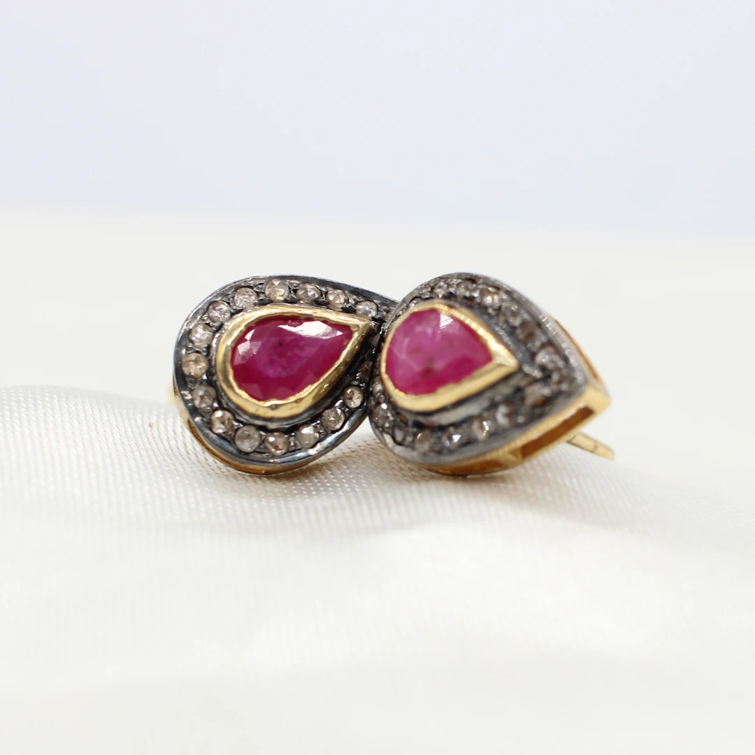 RUBY & DIAMOND EAR STUDS.