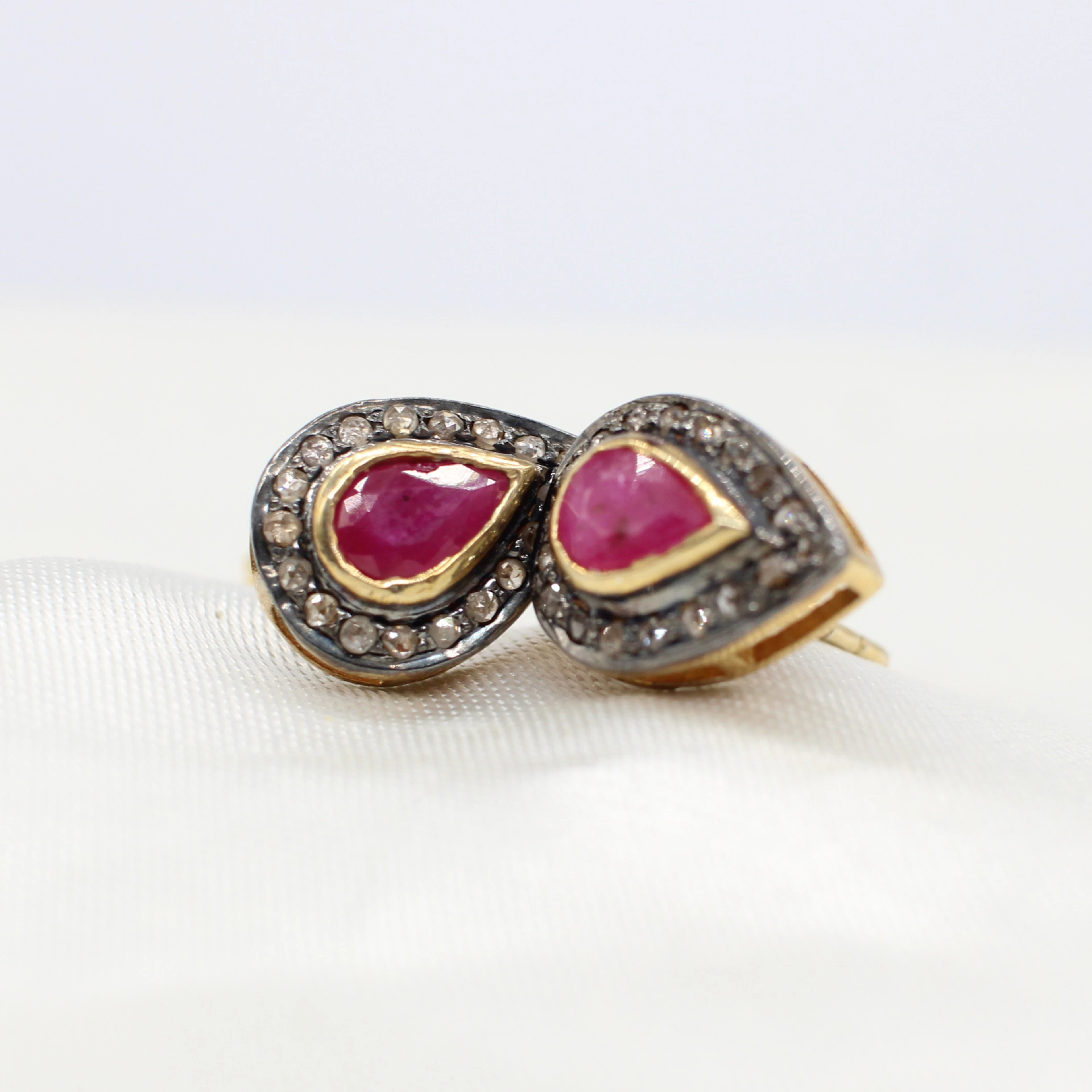 RUBY & DIAMOND EAR STUDS.