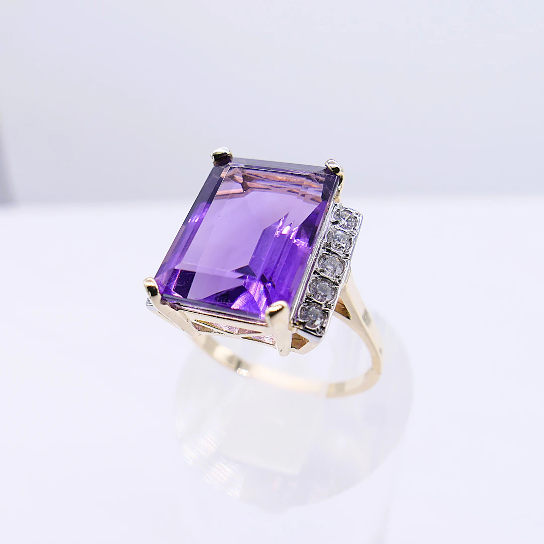 YELLOW AND WHITE GOLD AMETHYST AND DIAMOND DRESS RING.