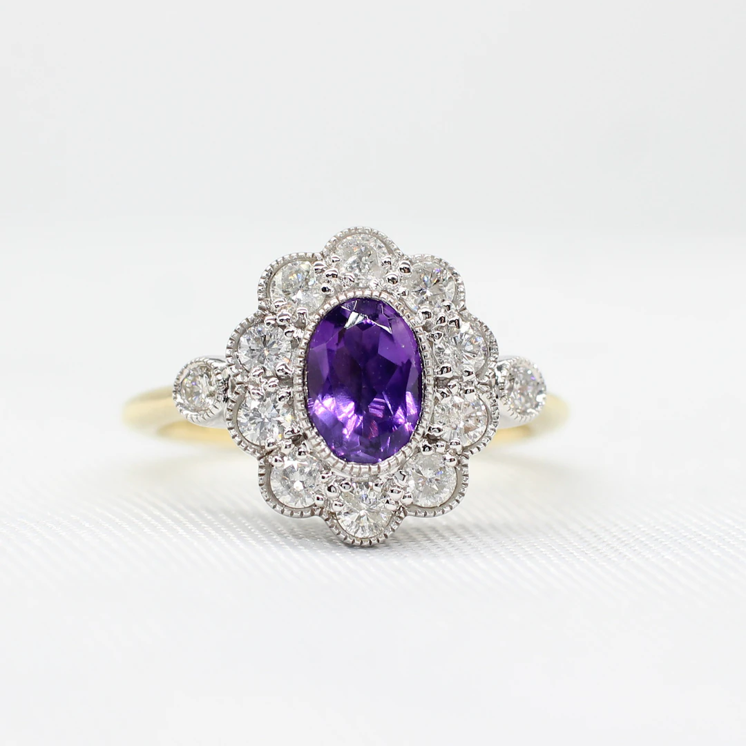 AMETHYST & DIAMOND DAISY RING.