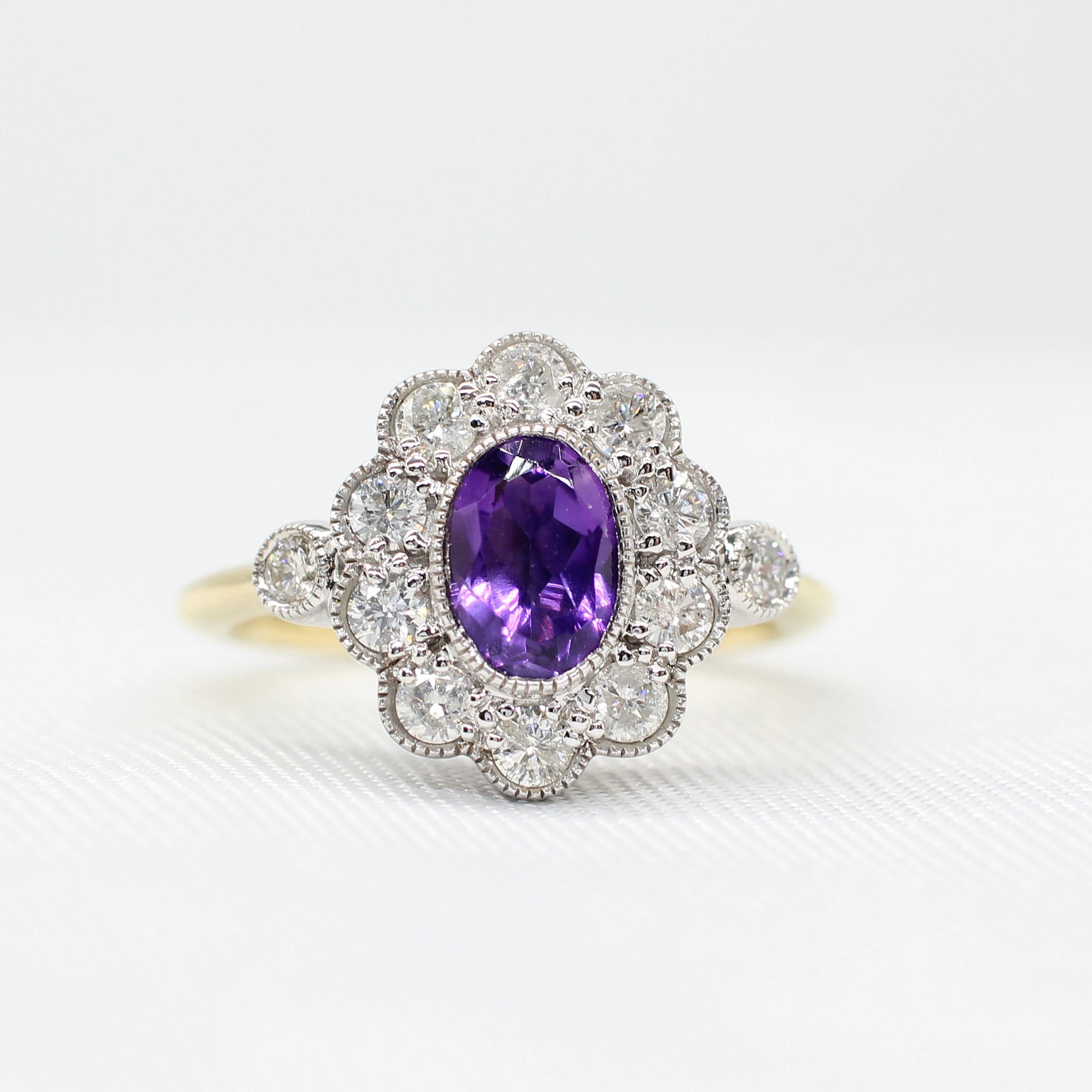 AMETHYST & DIAMOND DAISY RING.