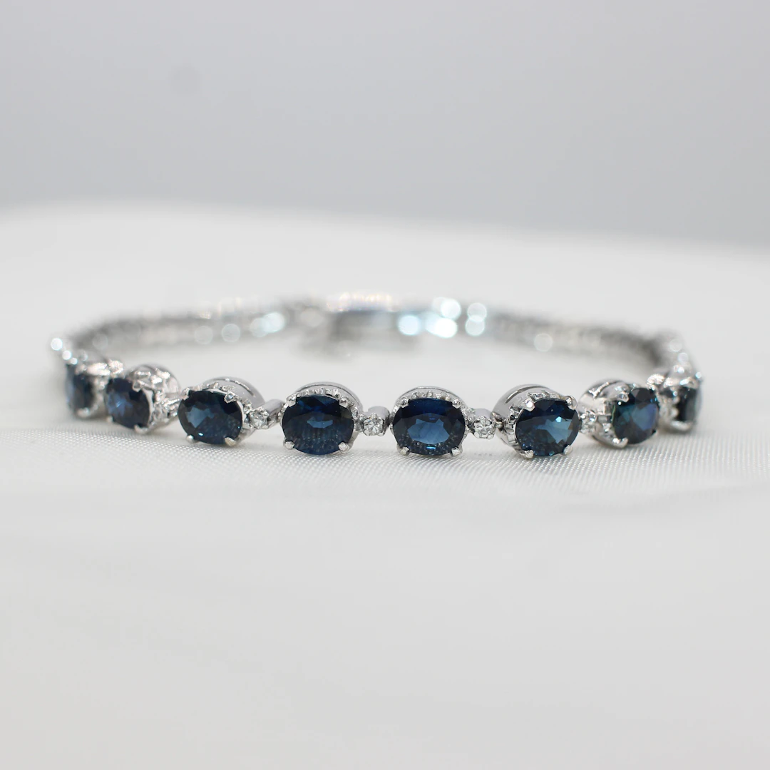 WHITE GOLD, SAPPHIRE & DIAMOND BRACELET.