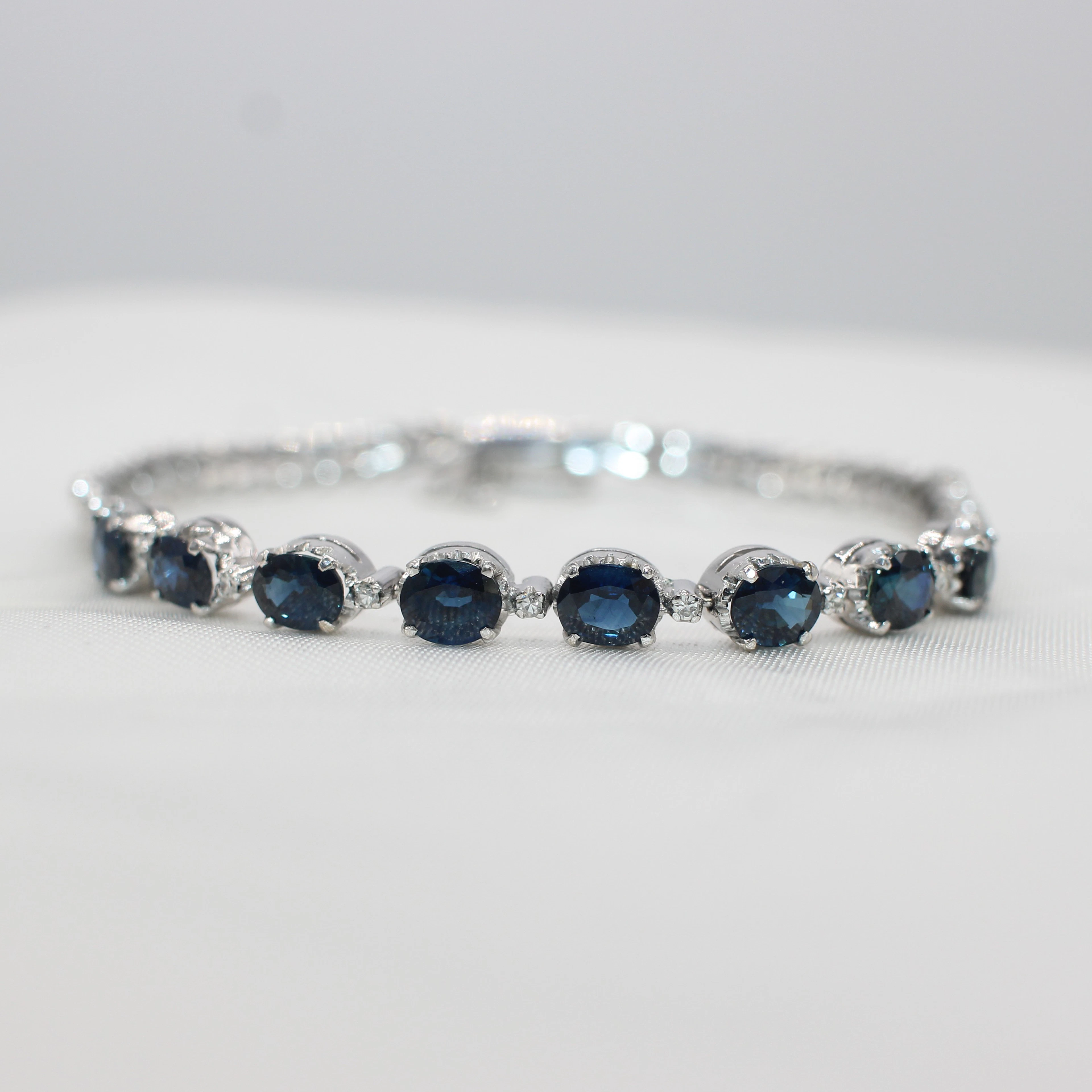 WHITE GOLD, SAPPHIRE & DIAMOND BRACELET.