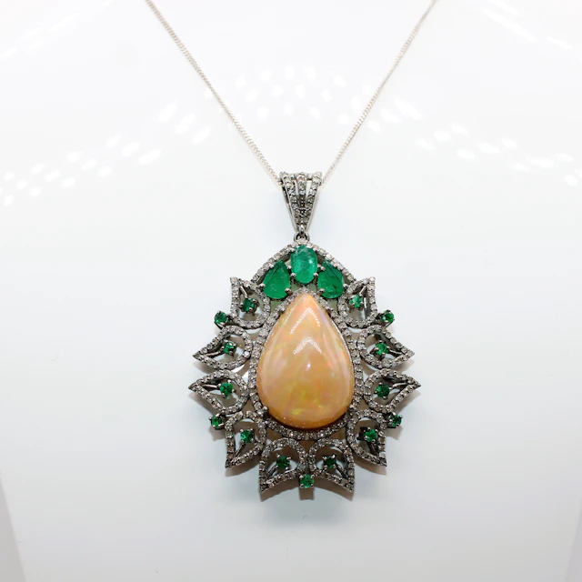 LARGE OPAL, EMERALD & DIAMOND PENDANT.