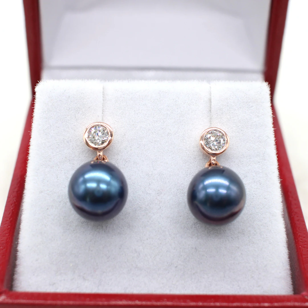 IRIDESCENT PEARL & DIAMOND EARRINGS.