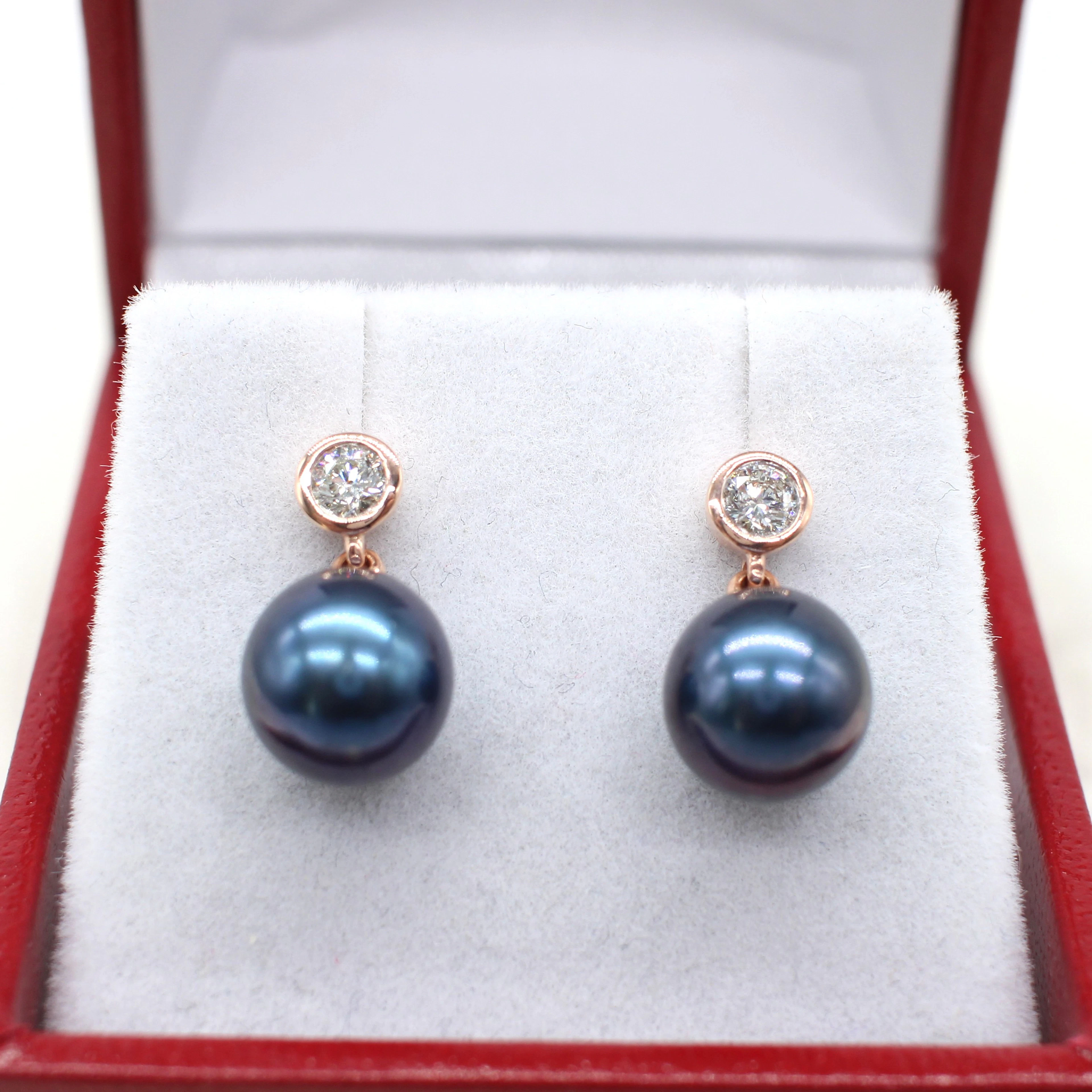 IRIDESCENT PEARL & DIAMOND EARRINGS.