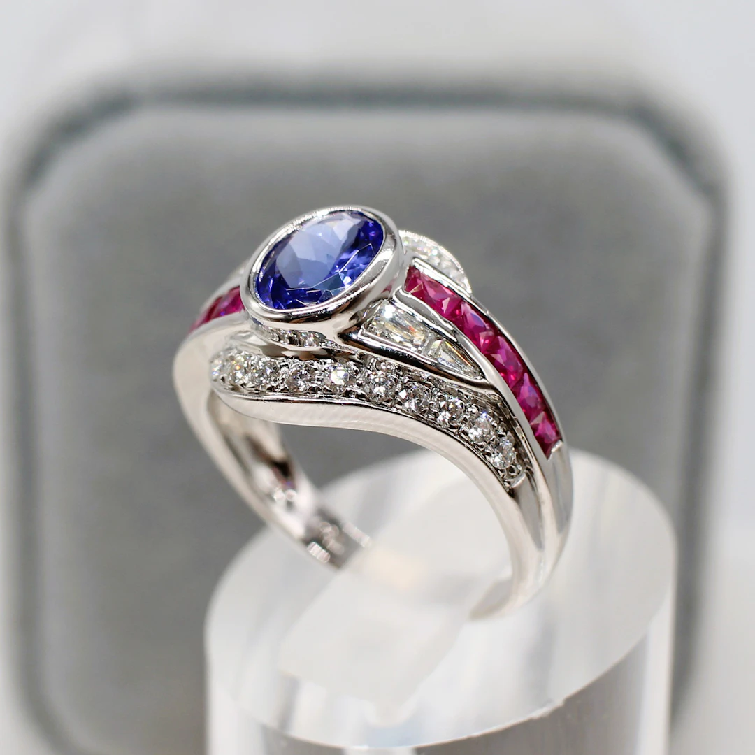 TANZANITE, RUBY & DIAMOND DRESS RING.