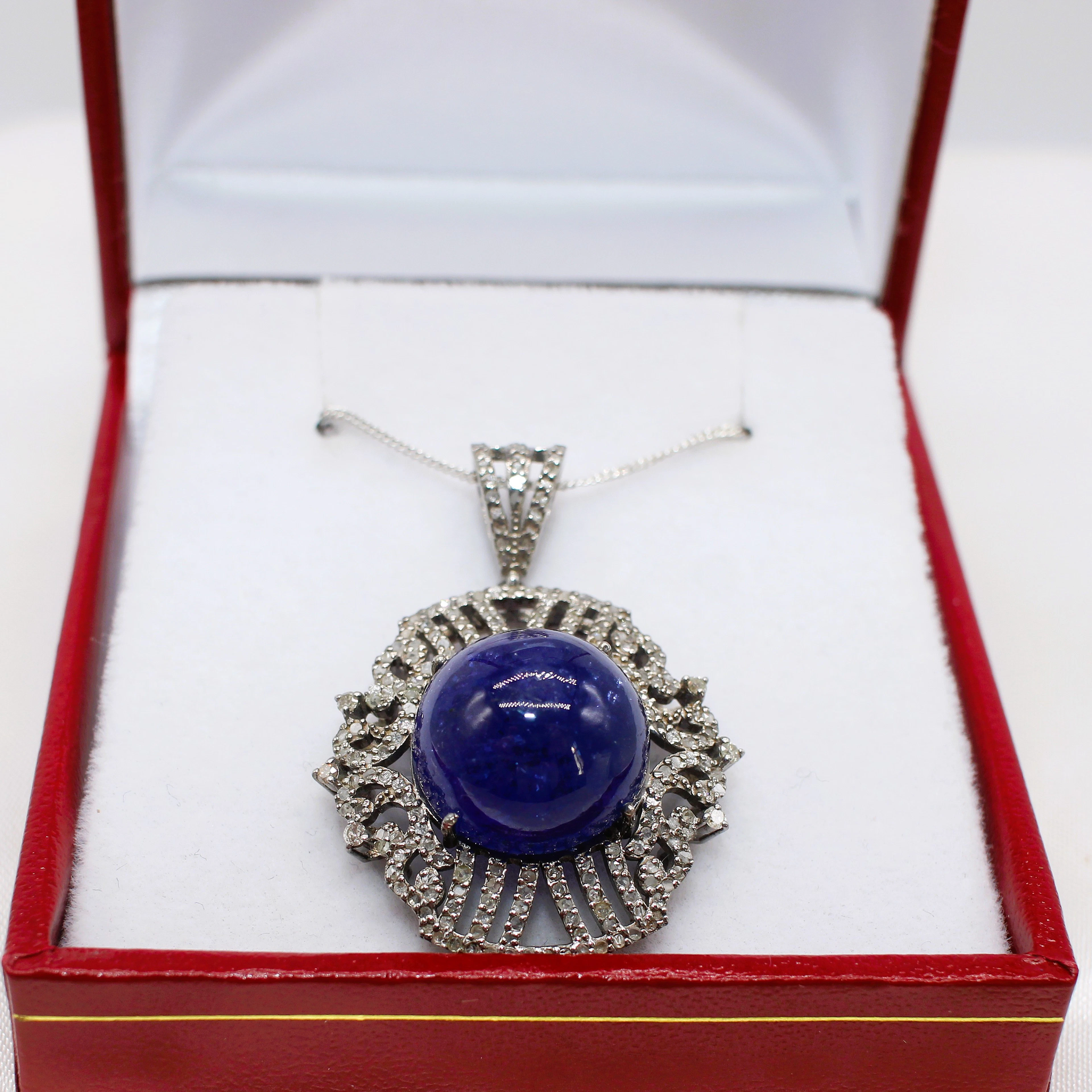 CABOCHON TANZANITE & DIAMOND NECKLACE.
