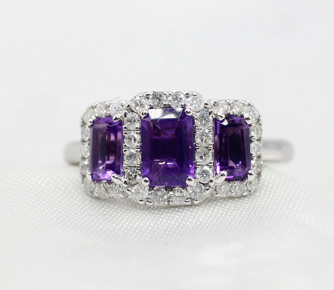 AMETHYST & DIAMOND TRILOGY CLUSTER RING.