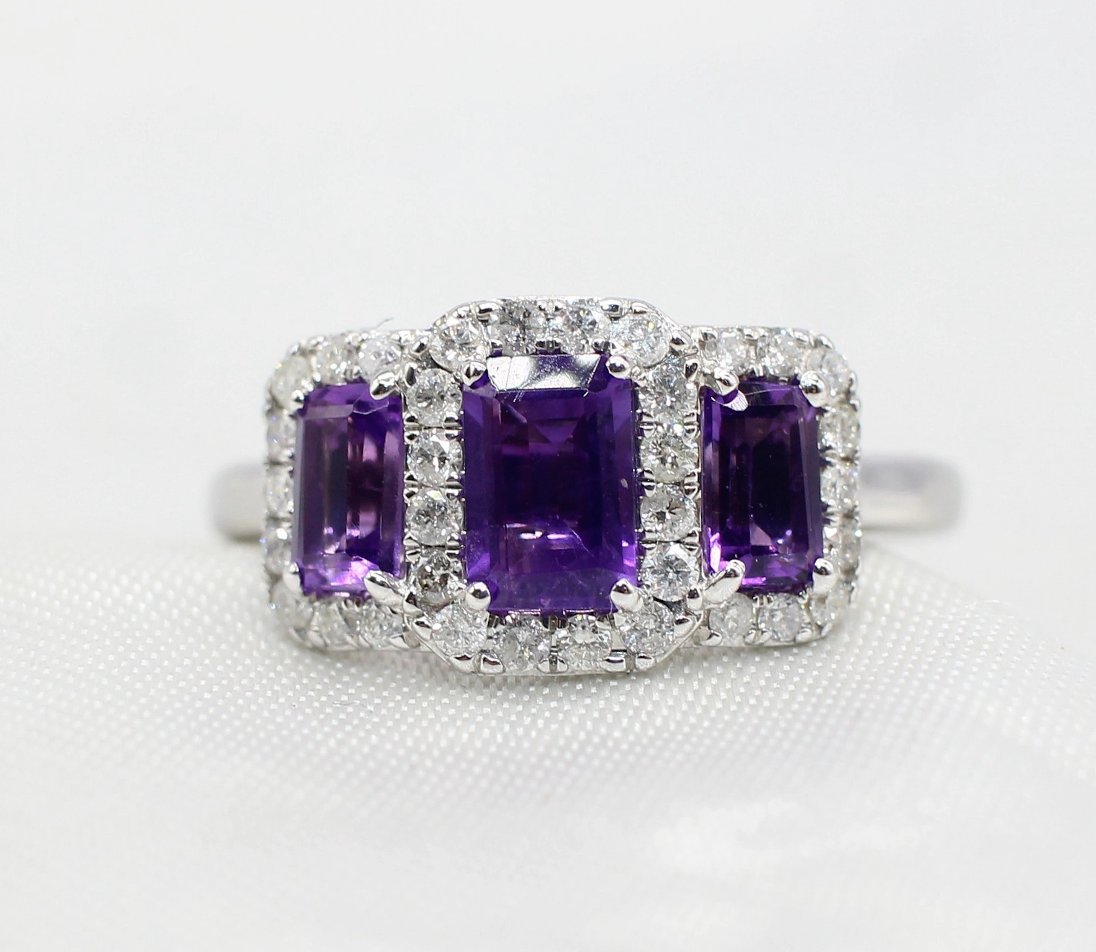 AMETHYST & DIAMOND TRILOGY CLUSTER RING.