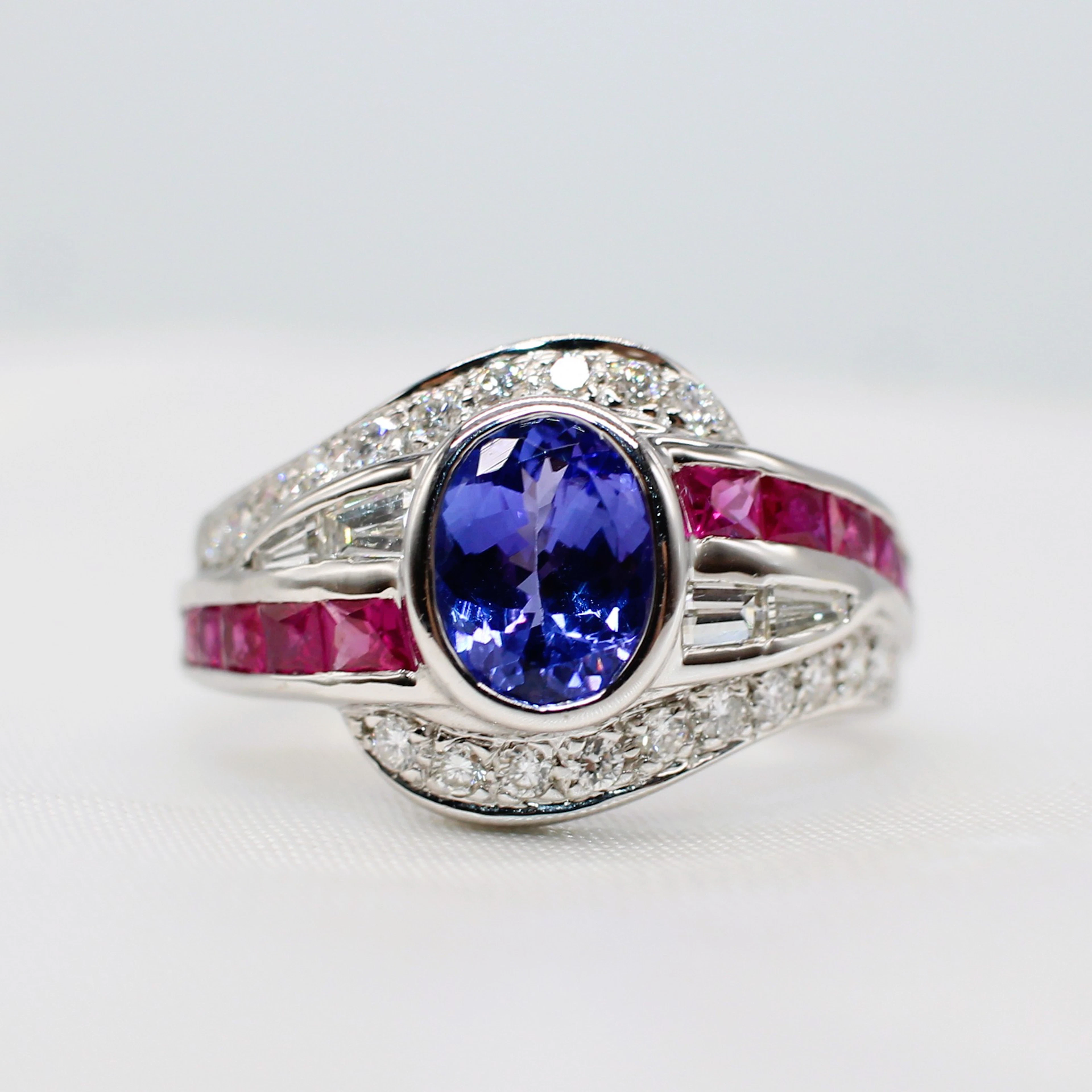 TANZANITE, RUBY & DIAMOND DRESS RING.